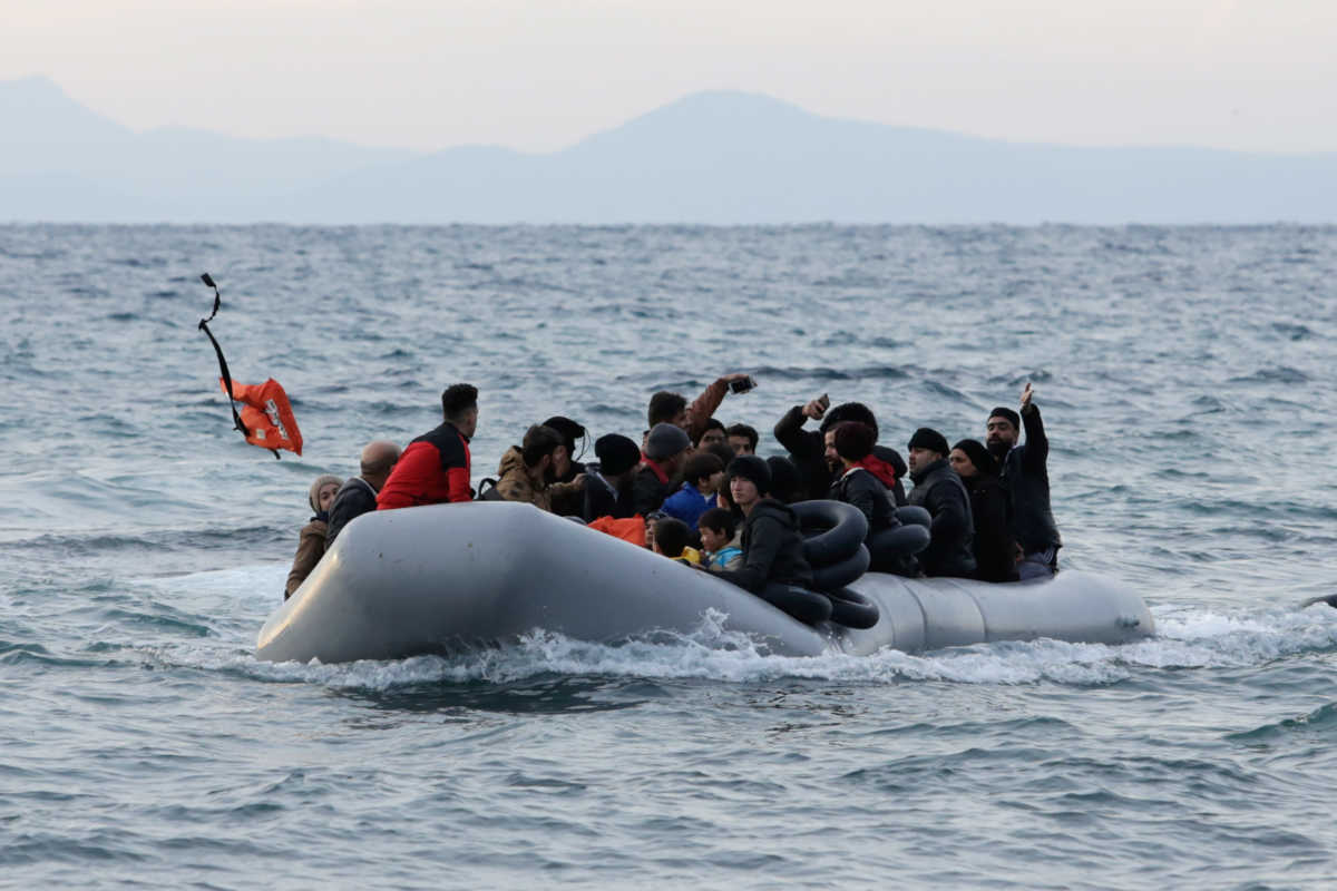 Migrants from Syria, Iraq, Afghanistan and Palestinian territories arrive on a dinghy near the city of Mytilene, after crossing part of the Aegean Sea from Turkey to the island of Lesbos, Greece, March 1, 2020. REUTERS