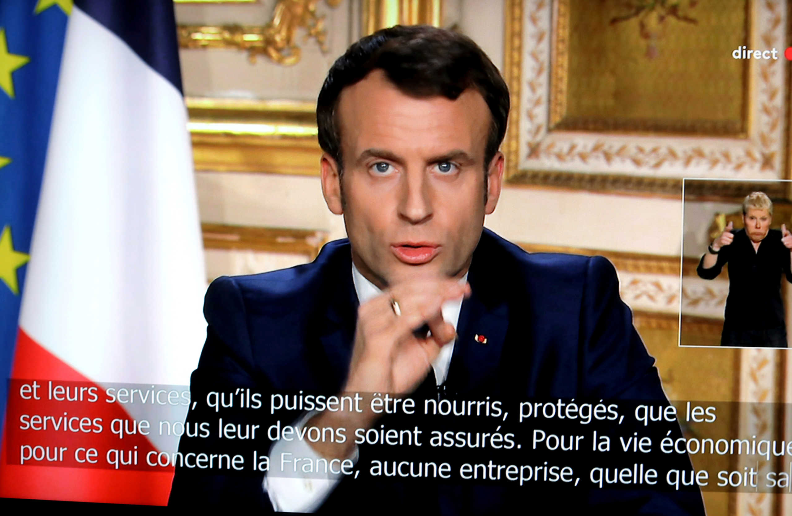 French President Emmanuel Macron is seen addresses the nation about the coronavirus disease (COVID-19) outbreak, on a mobile screen in this illustration picture taken March 16, 2020. REUTERS