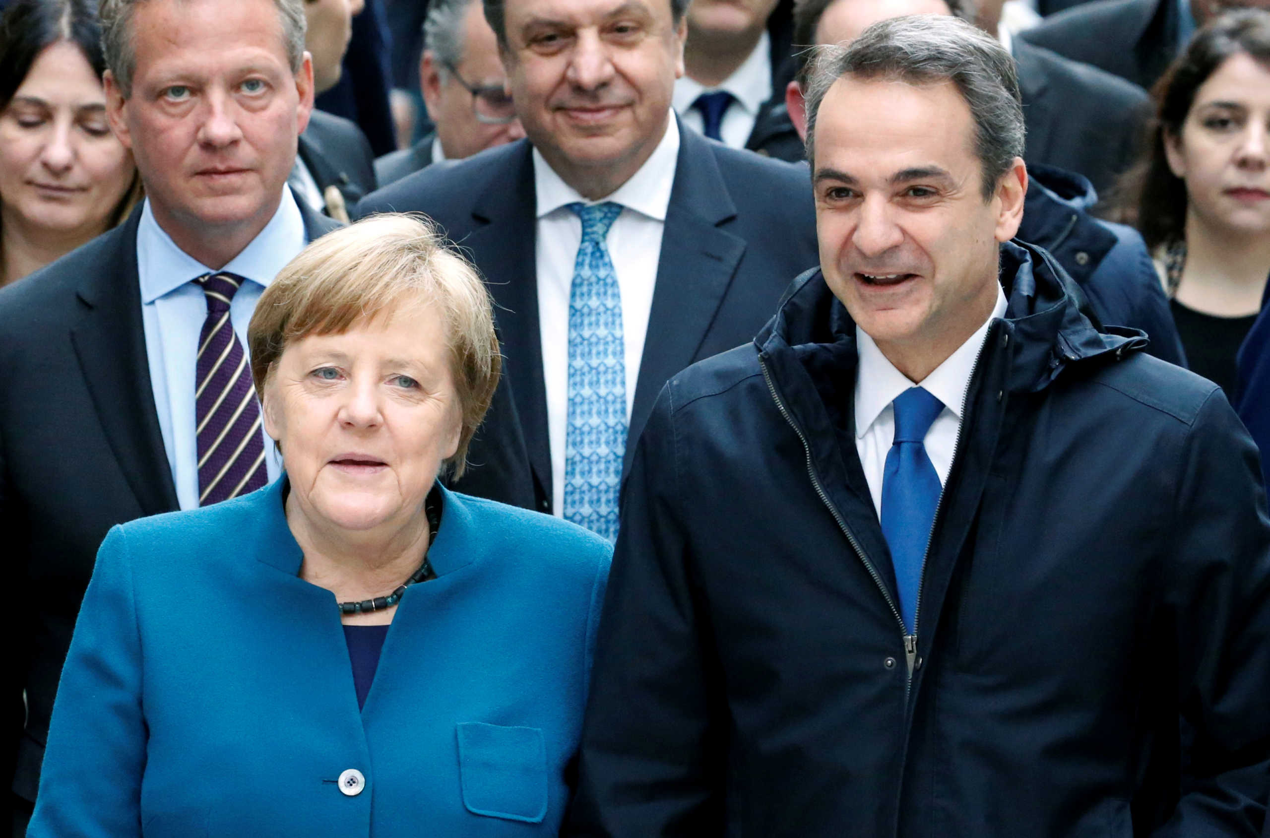 German Chancellor Angela Merkel and Greek Prime Minister Kyriakos Mitsotakis attend a German-Greek business forum in Berlin, Germany, March 9, 2020. REUTERS