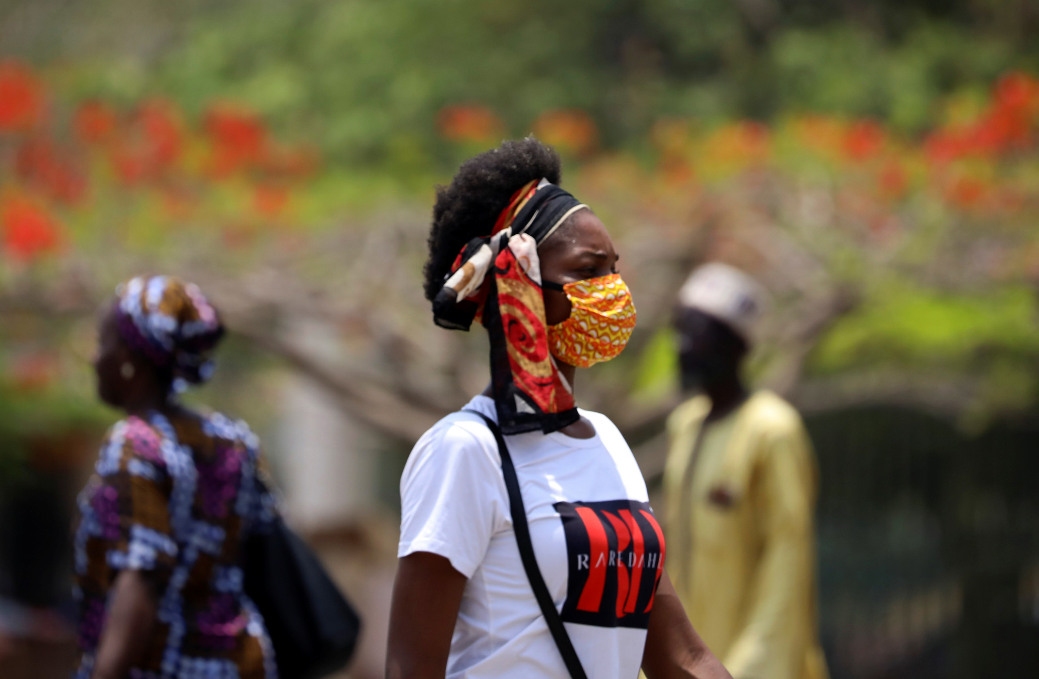 A girl wears a face mask at Wuse market, as the authorities try to limit the spread of the coronavirus disease (COVID-19), in Abuja, Nigeria March 27, 2020. REUTERS
