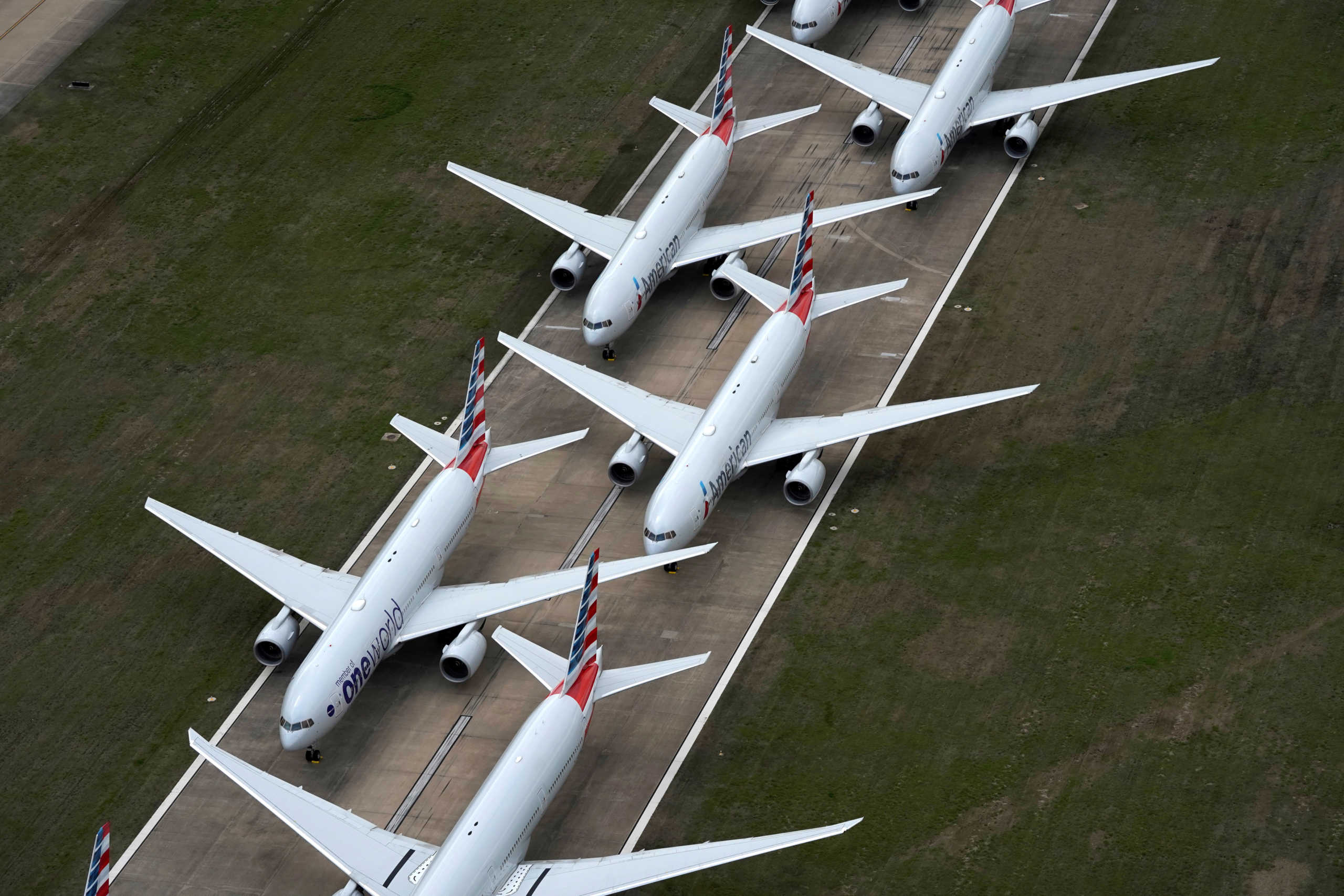 FILE PHOTO: American Airlines passenger planes crowd a runway where they are parked due to flight reductions made to slow the spread of coronavirus disease (COVID-19), at Tulsa International Airport in Tulsa, Oklahoma, U.S. March 23, 2020. REUTERS