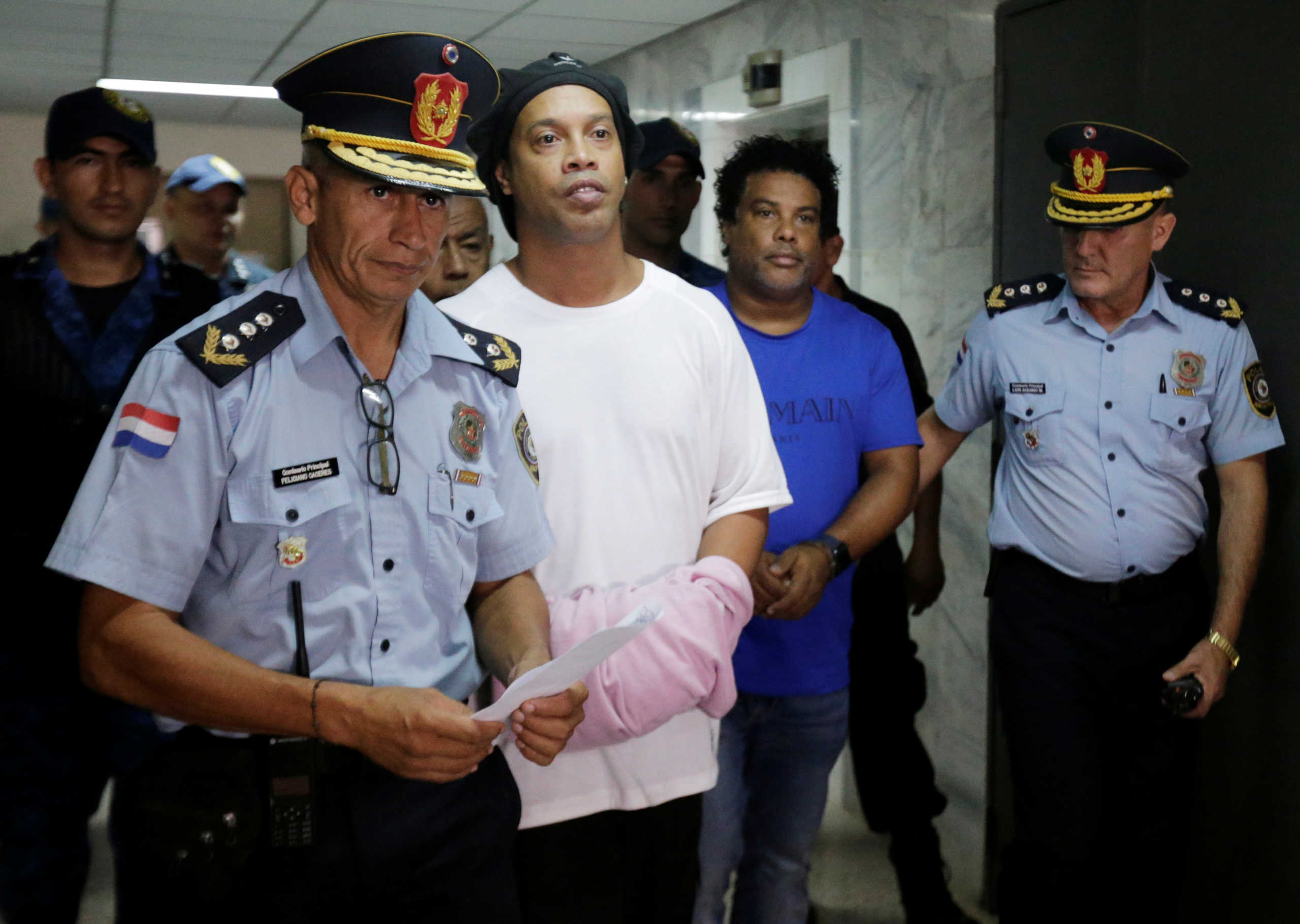 Judge rules Ronaldinho must remain in Paraguayan jail - Paraguayan Supreme Court, Asuncion, Paraguay - March 7, 2020? Ronaldinho and his brother Roberto de Asis handcuffed and escorted by police at the Supreme Court of Paraguay?REUTERS