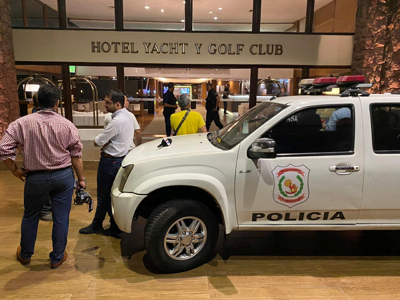 Ronaldinho is summoned to testify in Paraguay after being denounced for adulterated passports - Hotel Yacht y Golf Club, Asuncion, Paraguay - March 4, 2020  Paraguayan police officers at the entrance to the hotel where  two passports with allegedly adulterated contents were seized in the suite where he is staying REUTERS