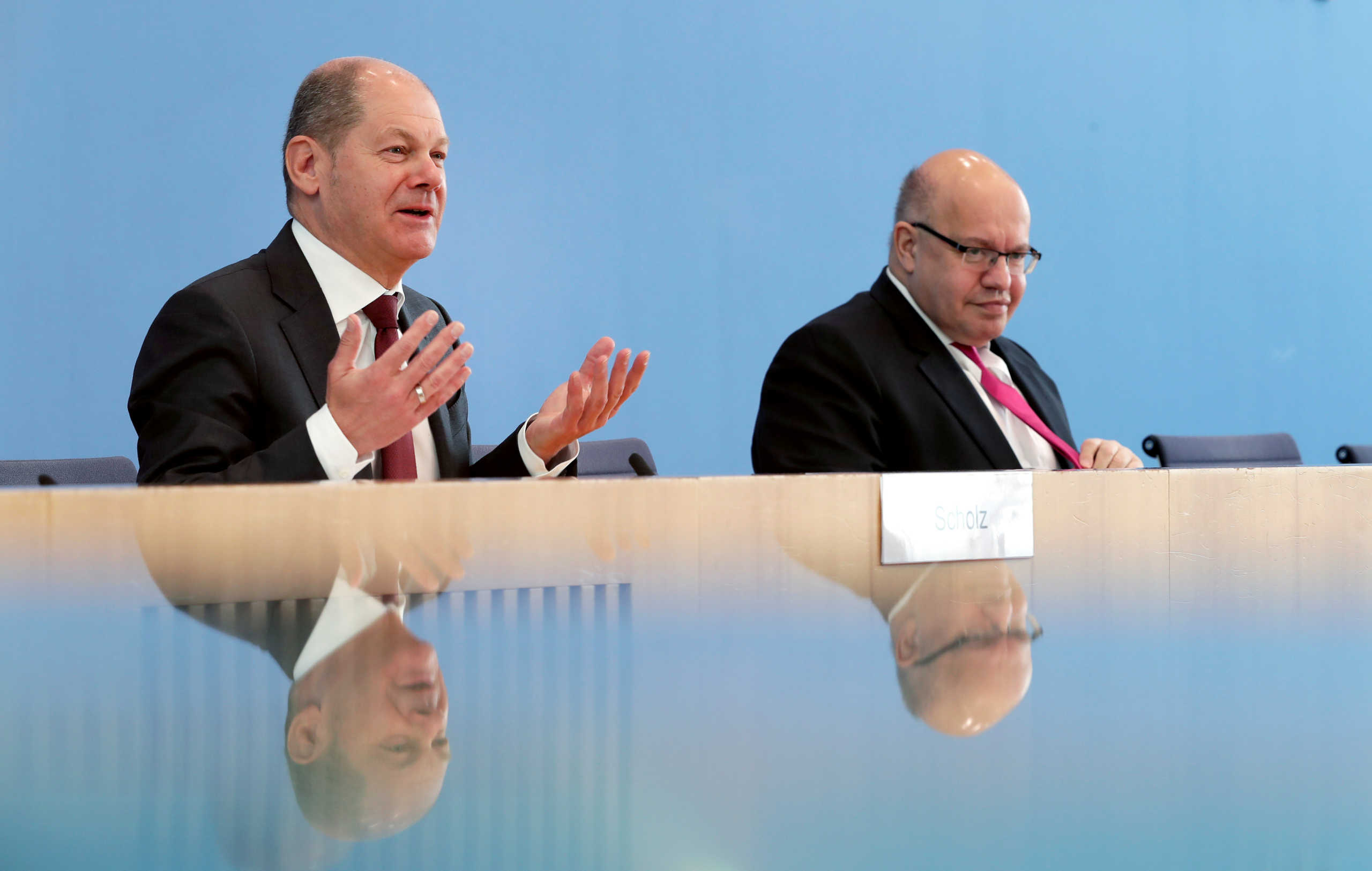 German Economy Minister Peter Altmaier and German Finance Minister Olaf Scholz address the media during a joint news conference to reveal details of a supplementary budget to counter the impact of the coronavirus disease (COVID-19) outbreak, in Berlin, Germany, March 23, 2020. Michael Sohn