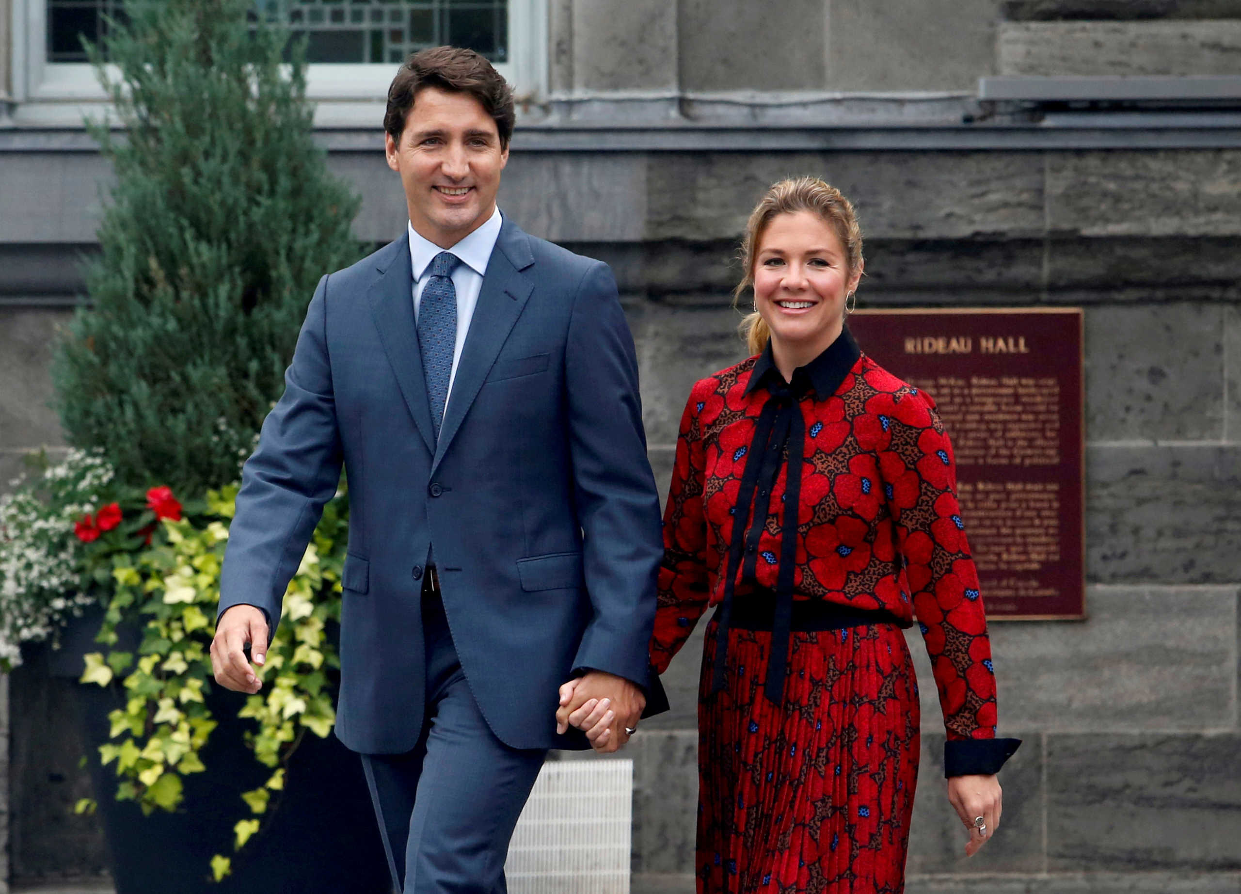 FILE PHOTO: Canada's Prime Minister Justin Trudeau and his wife Sophie Gregoire Trudeau leave Rideau Hall after asking Governor General Julie Payette to dissolve Parliament, and mark the start of a federal election campaign in Canada, in Ottawa, Ontario, Canada, September 11, 2019. REUTERS