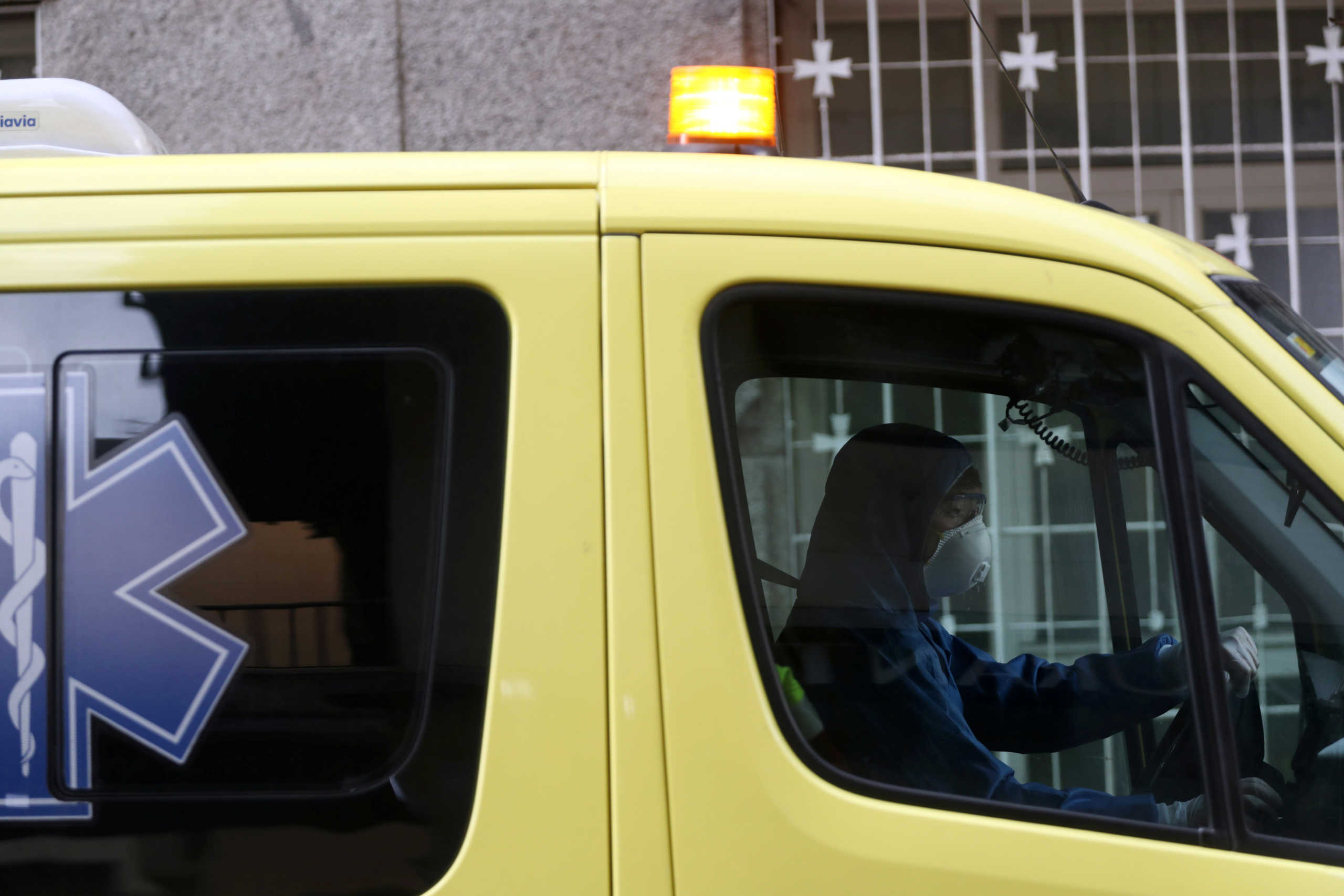 An ambulance worker in protective gear leaves La Princesa hospital during the coronavirus disease (COVID-19) outbreak in Madrid, Spain, March 25, 2020. REUTERS
