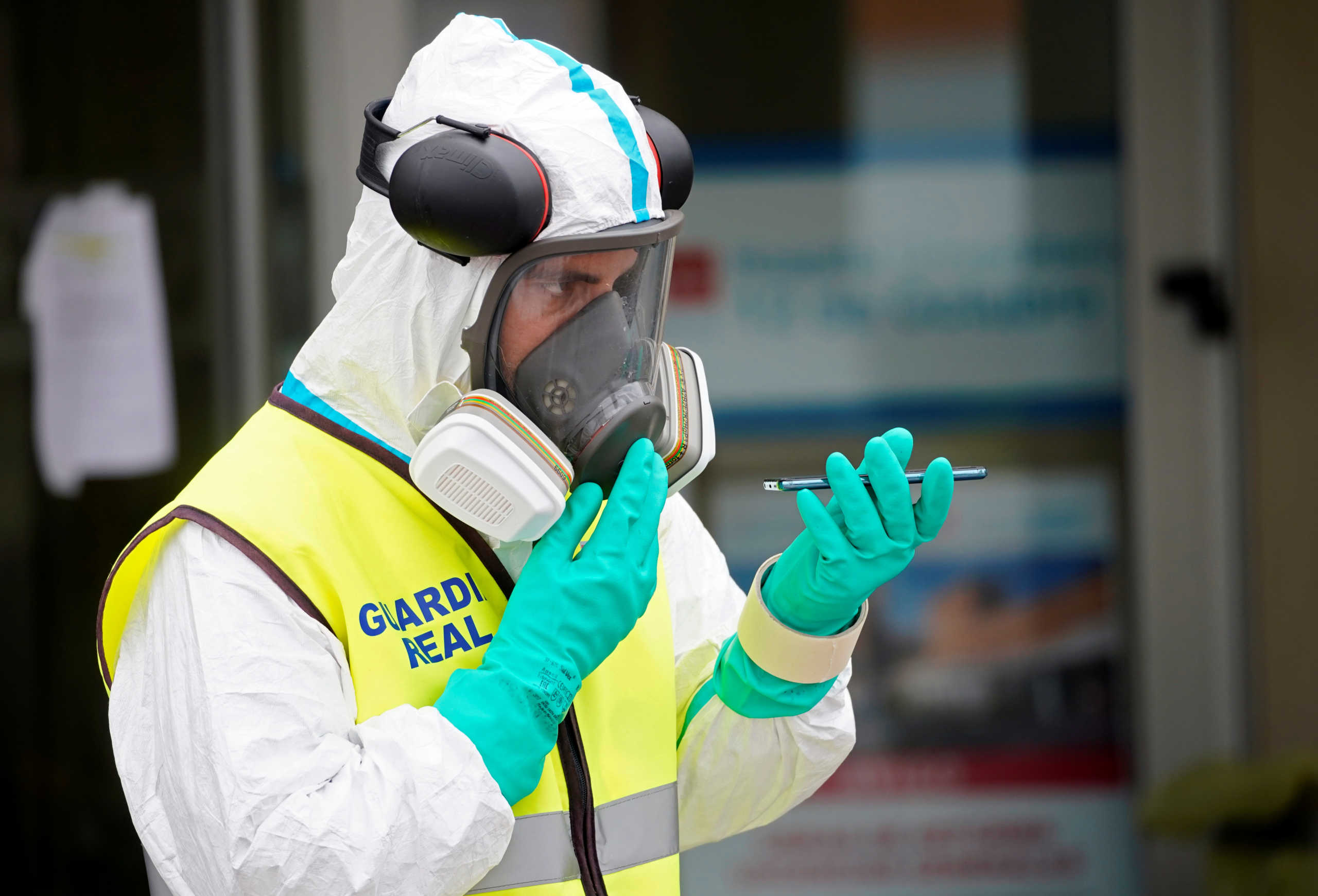A member of the Royal Guard wears protective gear outside the emergency unit at 12 de Octubre Hospital, amid the coronavirus disease (COVID-19) outbreak in Madrid, Spain March 30, 2020. REUTERS