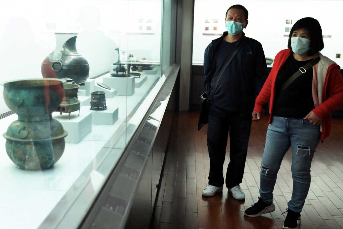 Visitors wear face masks to protect themselves from the coronavirus disease (COVID-19) at the National Palace Museum in Taipei, Taiwan, March 17, 2020. REUTERS