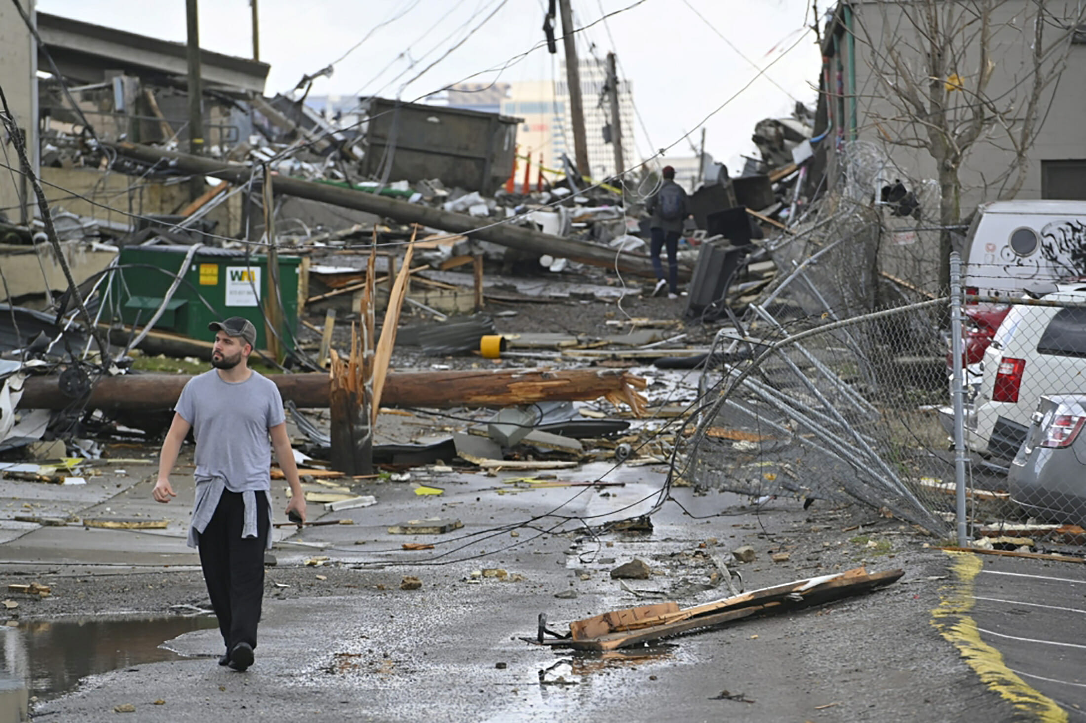 A man views damage in an alley behind Woodland Street after a tornado touched down in Nashville, Tennessee, U.S. March 3, 2020.  REUTERS