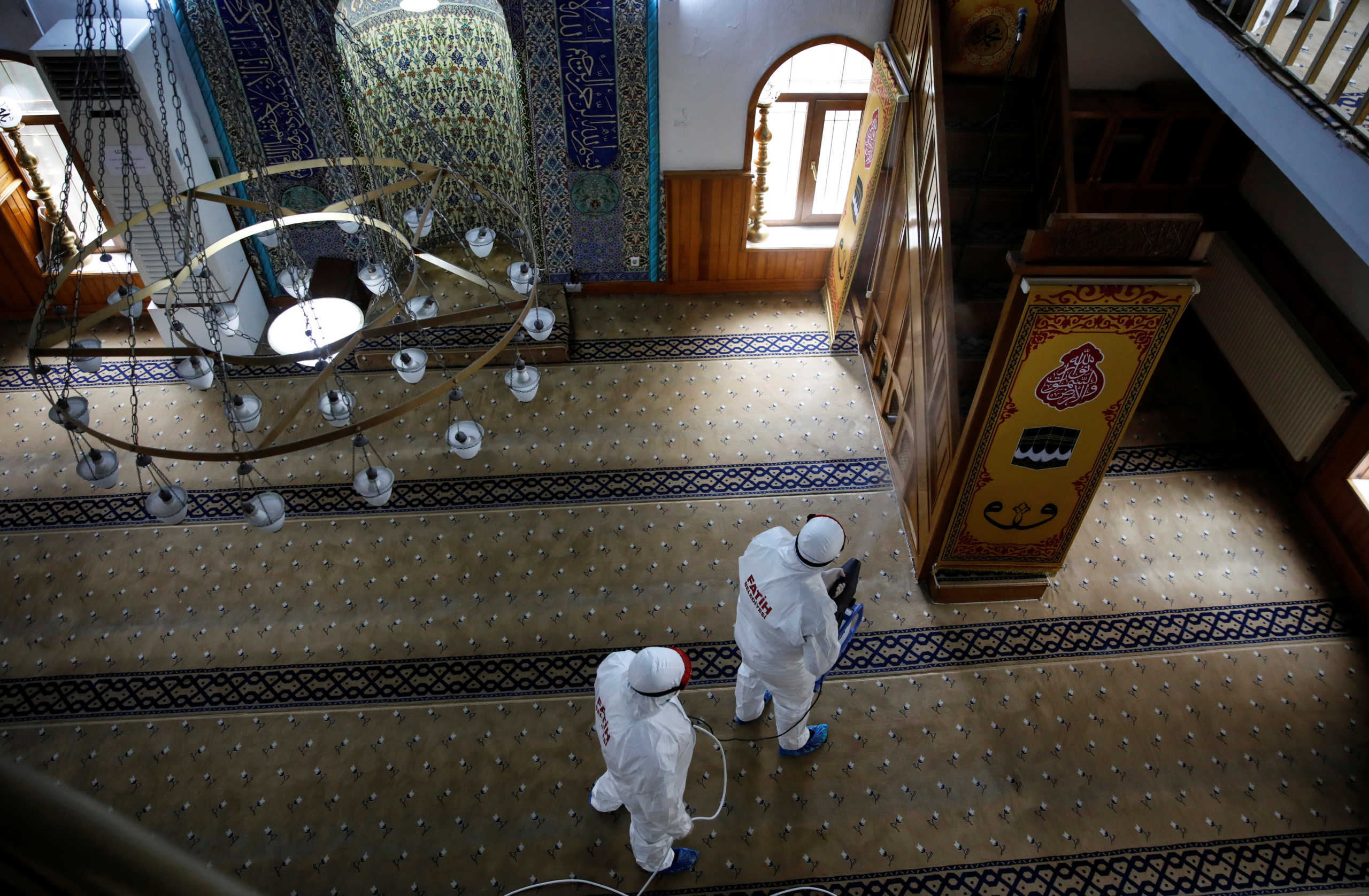 Workers in protective suits disinfect Molla Seref Mosque in Istanbul, Turkey March 16, 2020. REUTERS