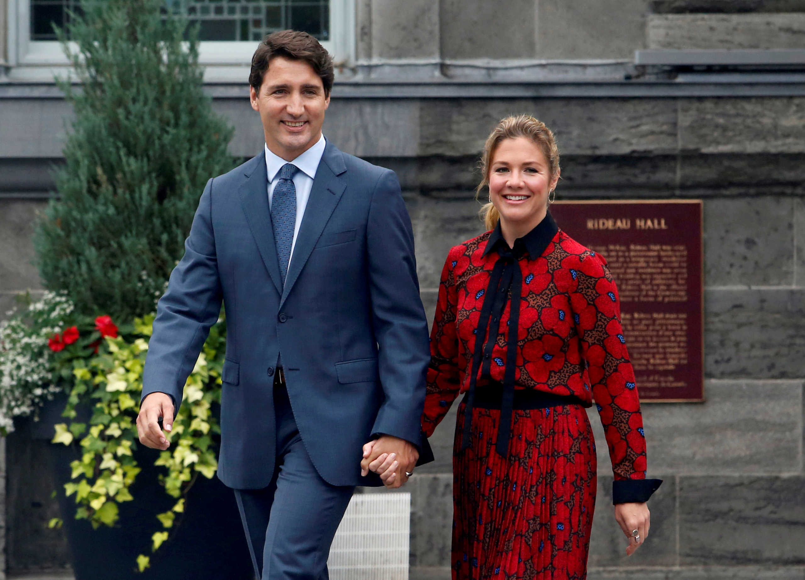 FILE PHOTO: Canada's Prime Minister Justin Trudeau and his wife Sophie Gregoire Trudeau leave Rideau Hall after asking Governor General Julie Payette to dissolve Parliament, and mark the start of a federal election campaign in Canada, in Ottawa, Ontario, Canada, September 11, 2019.  REUTERS