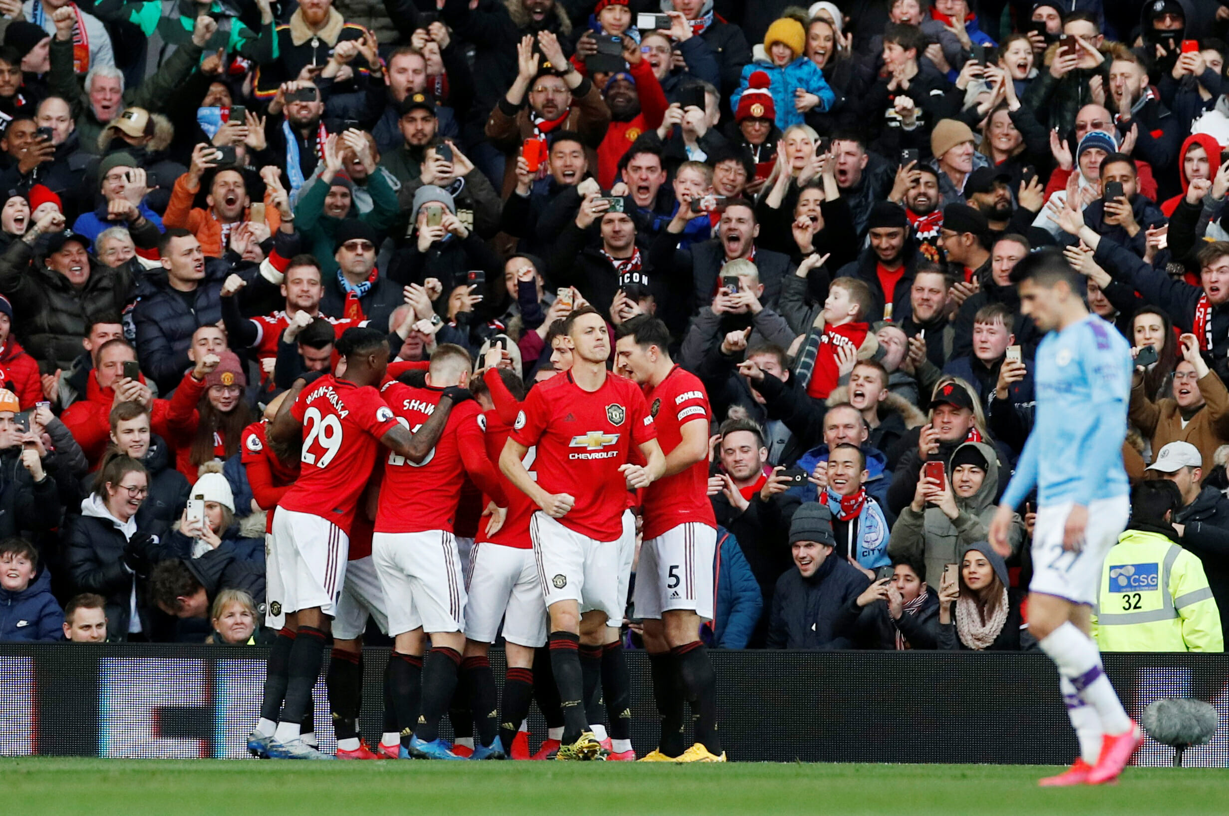 Soccer Football - Premier League - Manchester United v Manchester City - Old Trafford, Manchester, Britain - March 8, 2020  Manchester United's Anthony Martial celebrates scoring their first goal with teammates   REUTERS