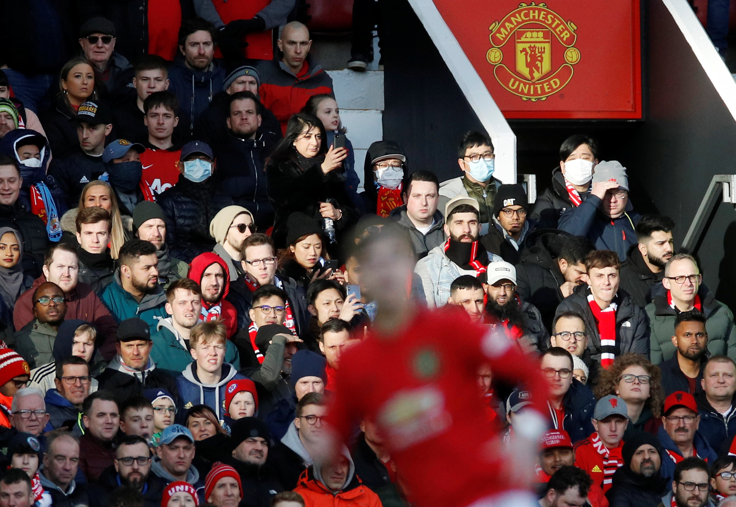 Soccer Football - Premier League - Manchester United v Manchester City - Old Trafford, Manchester, Britain - March 8, 2020  General view during the match as some fans wear masks as the number of coronavirus cases grow around the world  REUTERS
