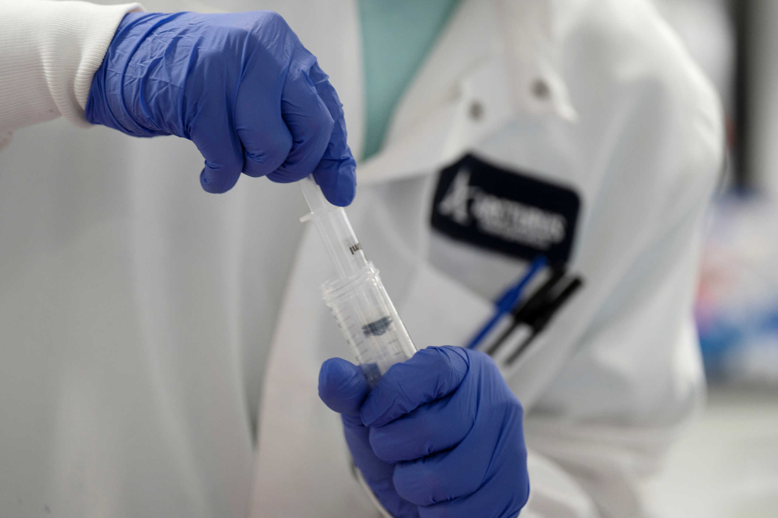 FILE PHOTO: A scientist conducts research on a vaccine for the novel coronavirus (COVID-19) at the laboratories of RNA medicines company Arcturus Therapeutics in San Diego, California, U.S., March 17, 2020. REUTERS