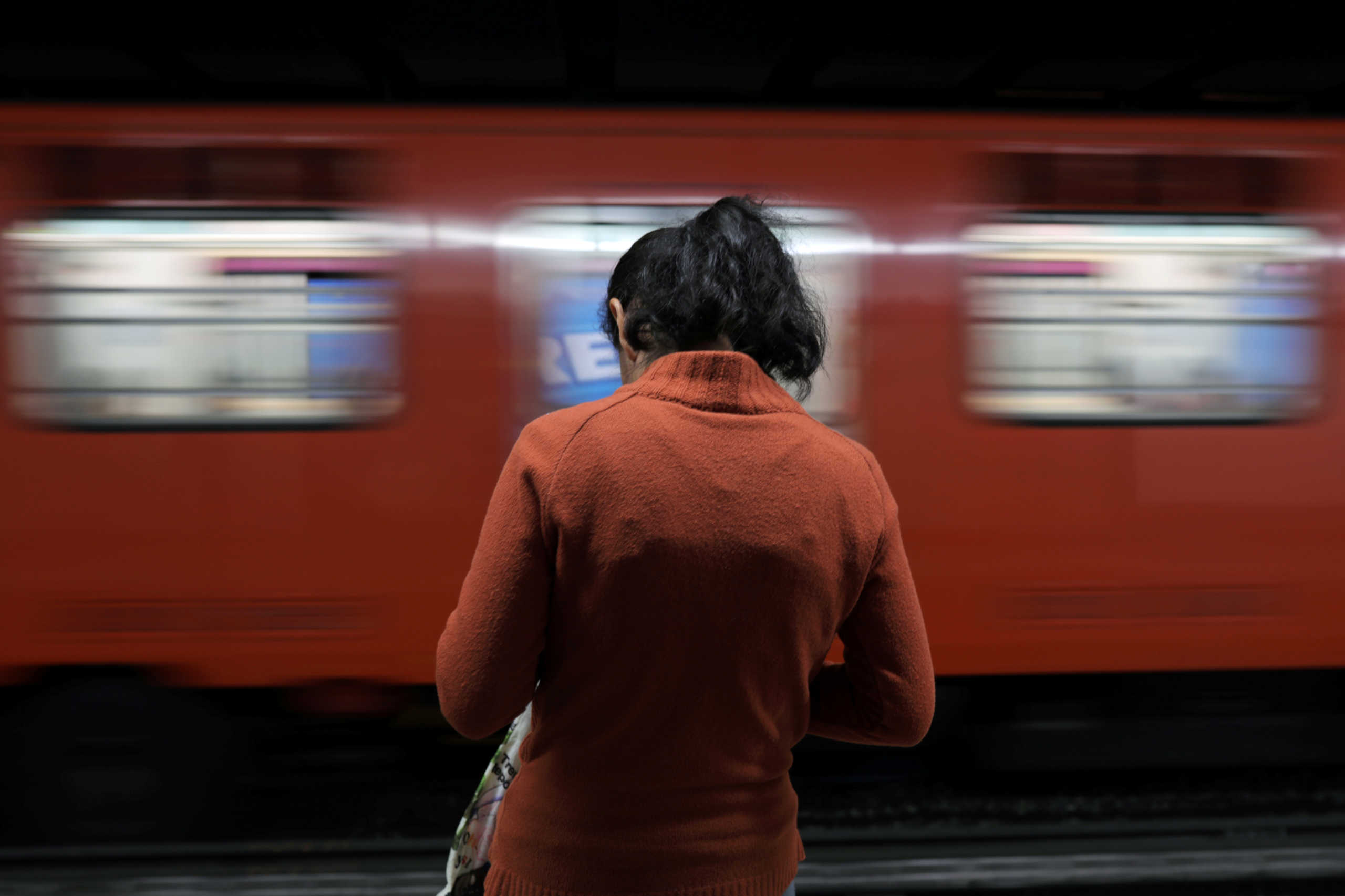 A woman waits at a subway station during the "A Day Without Women" protest, as part of the escalation of historic protests against gender violence, in Mexico City, Mexico March 9, 2020. REUTERS