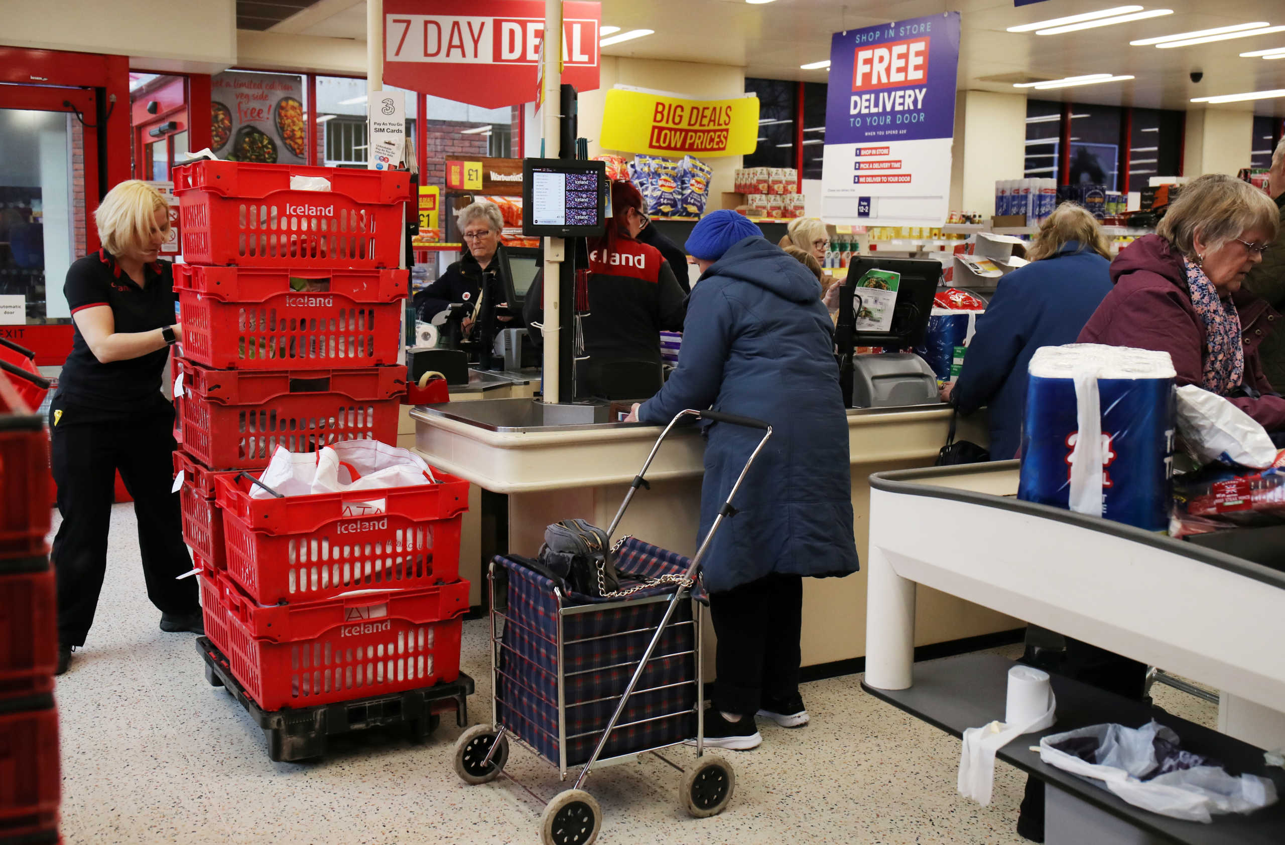 People at an Iceland store in Northwich after opening one hour early to allow elderly shoppers to buy food as the spread of the coronavirus disease (COVID-19) continues, in Northwich, Britain, March 18, 2020. REUTERS