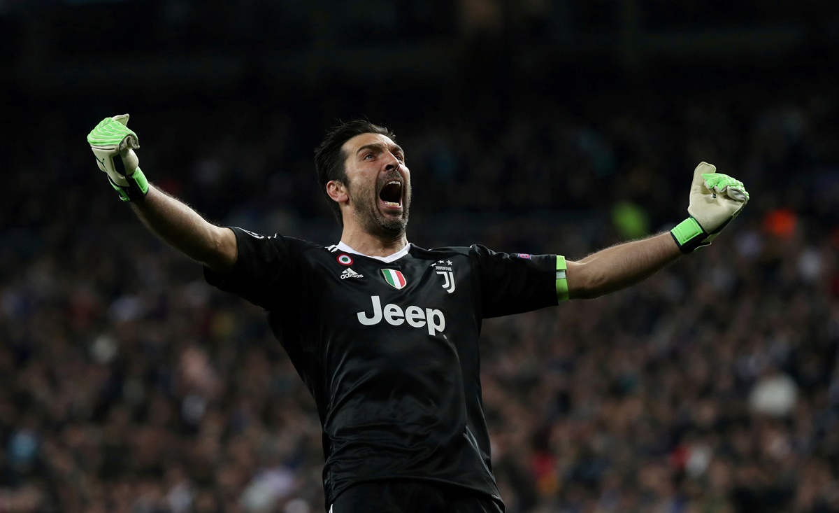 FILE PHOTO: ON THIS DAY -- April 11  April 11, 2018     SOCCER - Juventus goalkeeper Gianluigi Buffon celebrates their third goal scored by Blaise Matuidi in a 3-1 win against Real Madrid at the Santiago Bernabeu stadium, Madrid.     Buffon was later sent off after confronting referee Michael Oliver, who awarded Madrid a late penalty which Cristiano Ronaldo converted to send Juventus out of the competition 4-3 on aggregate.     Buffon moved to Paris St Germain in the close season after spending 17 years with Juventus but returned to the Italian side one season later and equalled former AC Milan defender Paolo Maldini's record for most Serie A appearances (647).  REUTERS