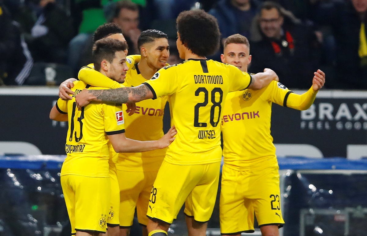 Soccer Football - Bundesliga - Borussia Moenchengladbach v Borussia Dortmund - Borussia-Park, Moenchengladbach, Germany - March 7, 2020  Borussia Dortmund's Achraf Hakimi celebrates scoring their second goal with teammates  REUTERS