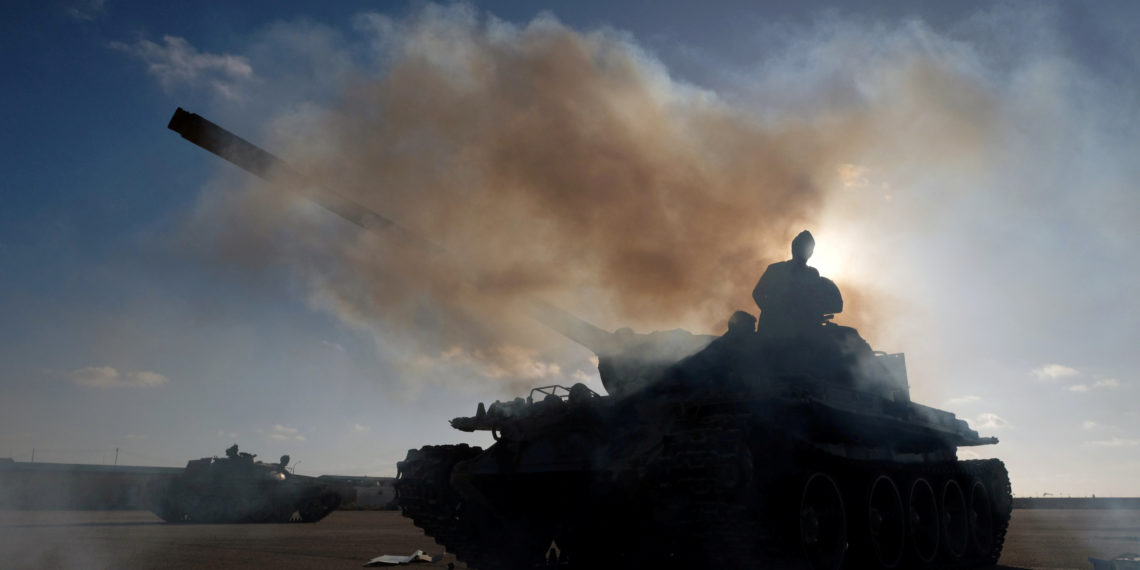 FILE PHOTO: Members of Libyan National Army (LNA) commanded by Khalifa Haftar, get ready before heading out of Benghazi to reinforce the troops advancing to Tripoli, in Benghazi, Libya April 13, 2019. REUTERS