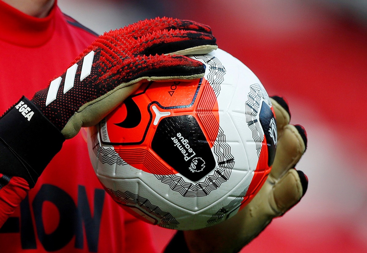 FILE PHOTO: Soccer Football - Premier League - Manchester United v Watford - Old Trafford, Manchester, Britain - February 23, 2020  General view of a match ball held by Manchester United's David de Gea during the warm up before the match   Action Images via Reuters