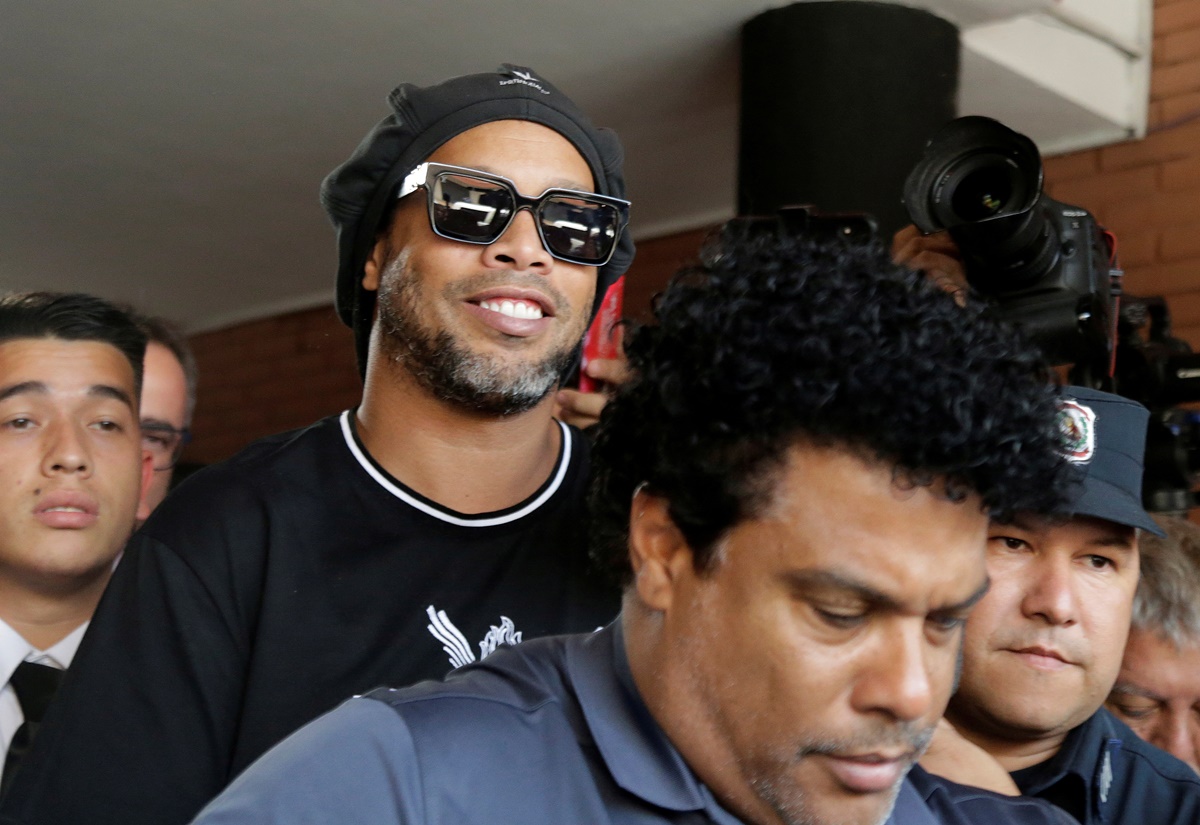 FILE PHOTO: Paraguay police question Ronaldinho over alleged 'adulterated' passport - Paraguayan Public Ministry, Asuncion, Paraguay - March 5, 2020   Ronaldinho leaves the Paraguayan Public Ministry where he testified along with his brother Roberto de Asis  REUTERS