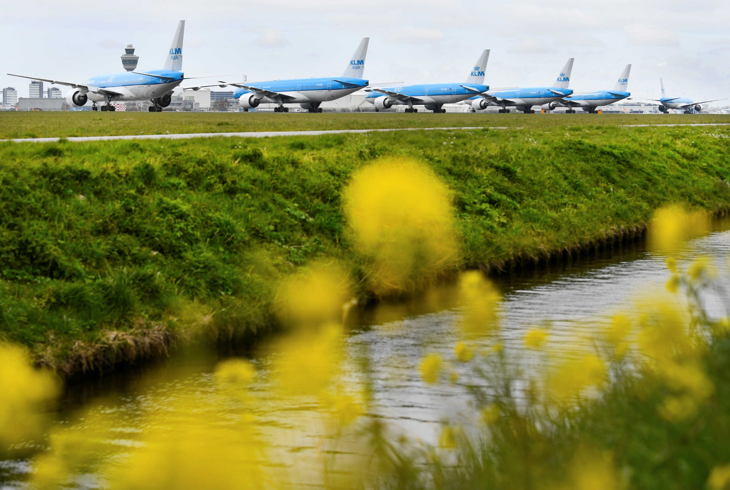 KLM airline airplanes are seen parked, as Schiphol Airport reduces its flights due to the coronavirus disease (COVID-19) outbreak, in Amsterdam, Netherlands April 2, 2020. REUTERS