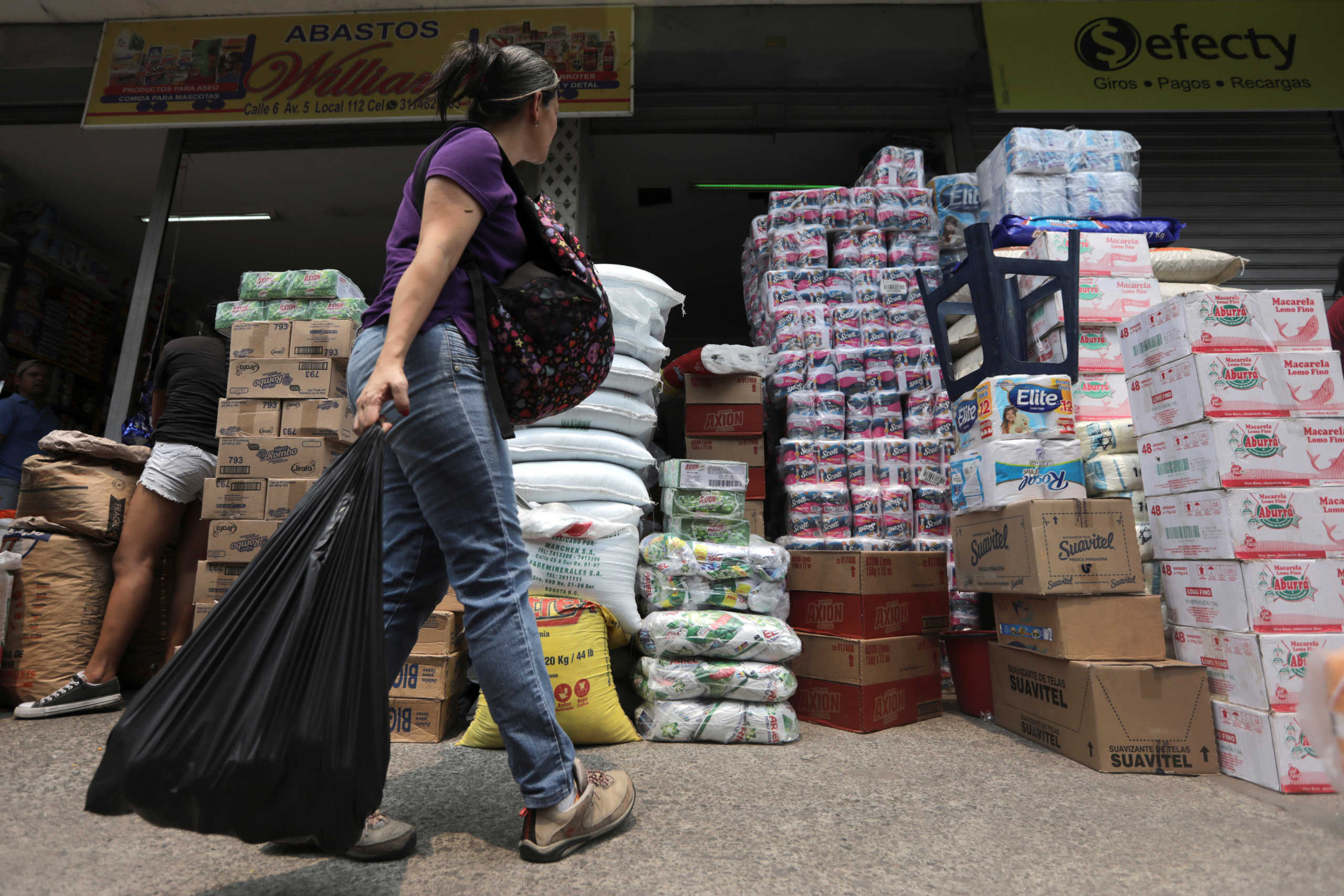 A woman looks at merchandise outside a supermarket in Cucuta, Colombia April 13, 2019. REUTERS
