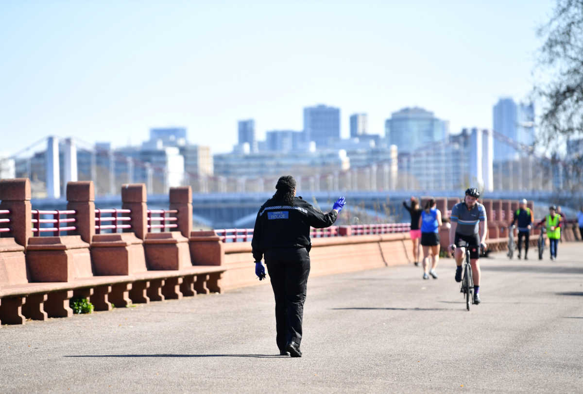 A police officer in Battersea Park, as the spread of the coronavirus disease (COVID-19) continues, London, Britain, April 5, 2020. REUTERS