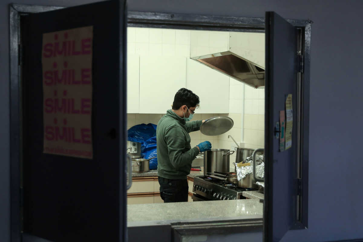 Riyadh Chowdhury, a volunteer chef with The Smile Brigade prepares meals to be delivered to local people in Fulham, as the spread of the coronavirus disease (COVID-19) continues in London, Britain, March 31, 2020.  REUTERS