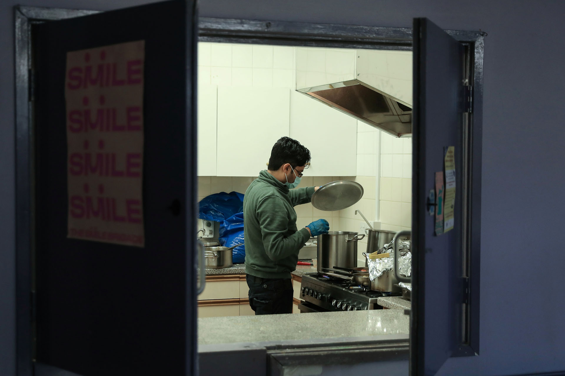 Riyadh Chowdhury, a volunteer chef with The Smile Brigade prepares meals to be delivered to local people in Fulham, as the spread of the coronavirus disease (COVID-19) continues in London, Britain, March 31, 2020.  REUTERS