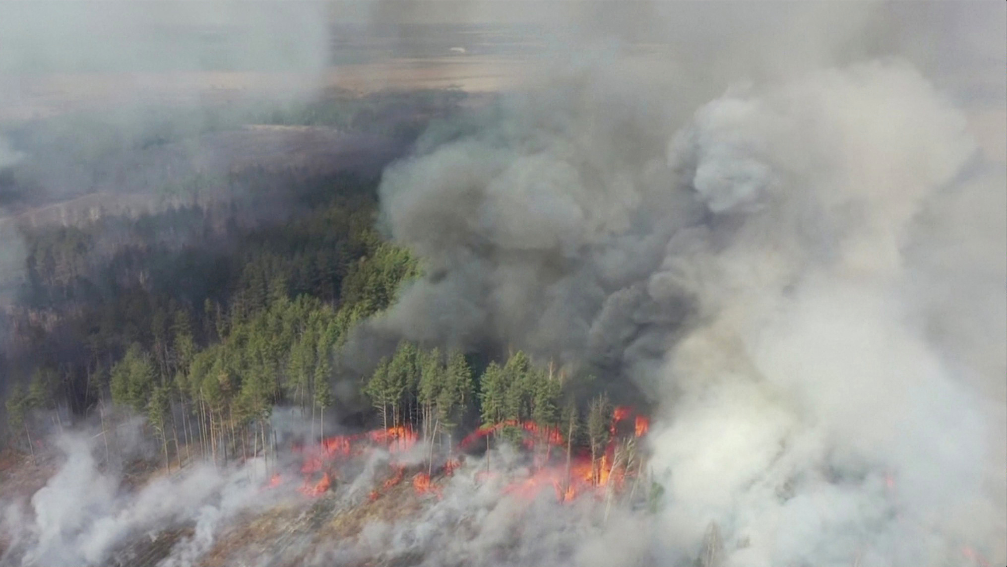 An aerial view shows a forest fire in the 30 km (19 miles) exclusion zone around the Chernobyl nuclear power plant, Ukraine, April 12, 2020, in this still picture taken from video. Video taken April 12, 2020. Reuters TV