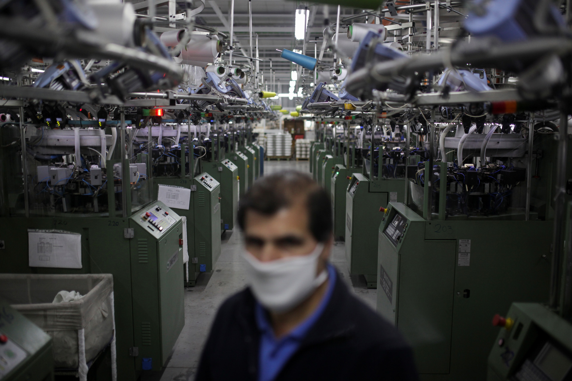 A worker wears a face mask inside a factory manufacturing face masks containing copper fibres, following the outbreak of the coronavirus disease (COVID-19) in Santiago, Chile April 17, 2020. REUTERS