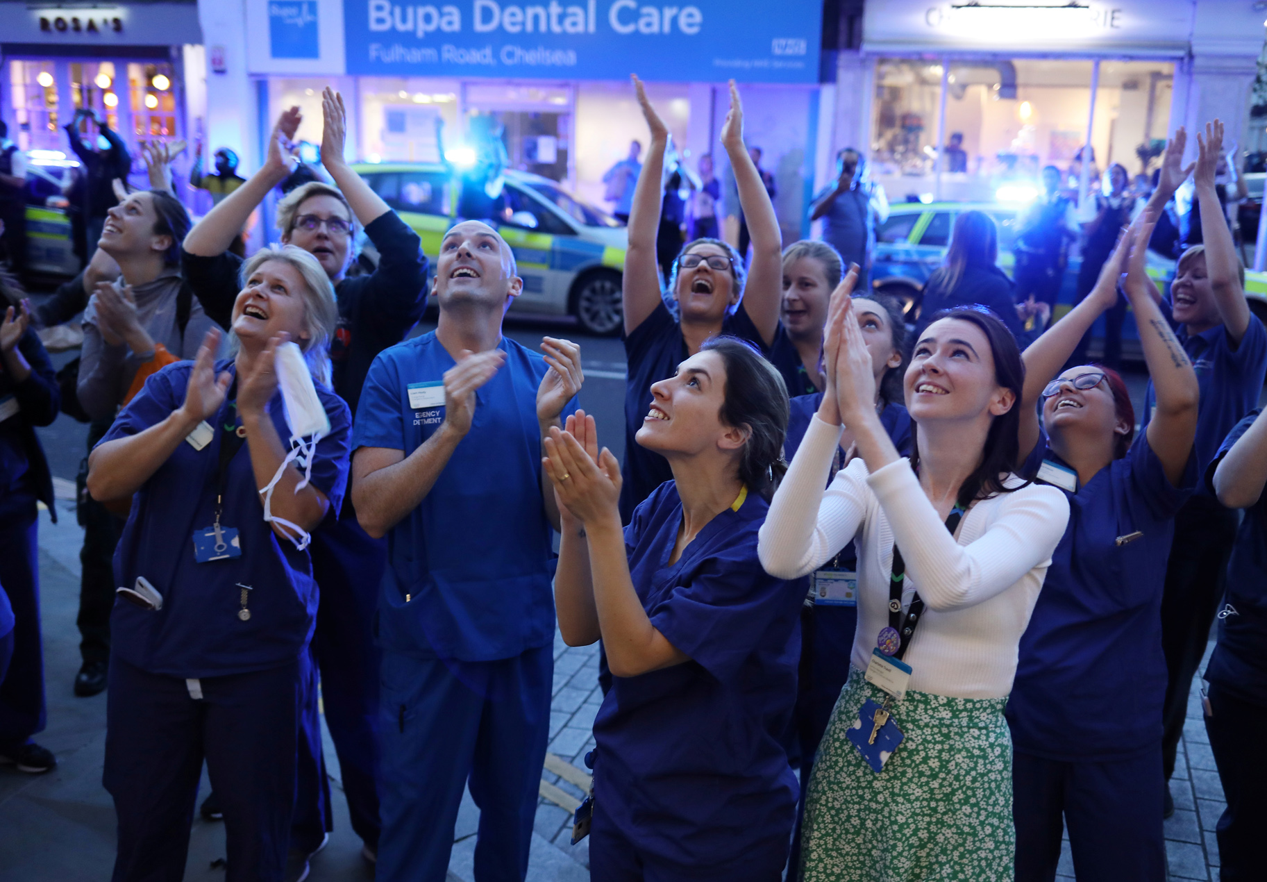 NHS workers applaud outside Chelsea and Westminster Hospital during the Clap for our Carers campaign in support of the NHS as the spread of the coronavirus disease (COVID-19) continues, London, Britain, April 9, 2020. REUTERS