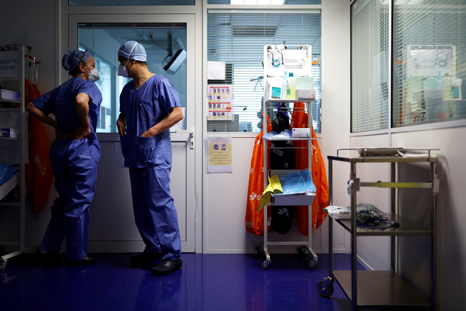 A medical staff members, wearing face masks, are seen in an intensive care unit for coronavirus disease (COVID-19) patients at the Clinique de l'Orangerie private hospital in Strasbourg, as the spread of the coronavirus disease continues, France April 17, 2020. REUTERS