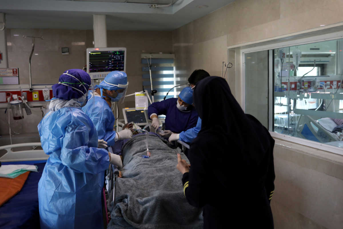 FILE PHOTO: Nurses wearing protective suits, prepare a patient with coronavirus disease (COVID-19) to be transferred to Masih Daneshvari Hospital, in Tehran, Iran March 30, 2020. WANA (West Asia News Agency)