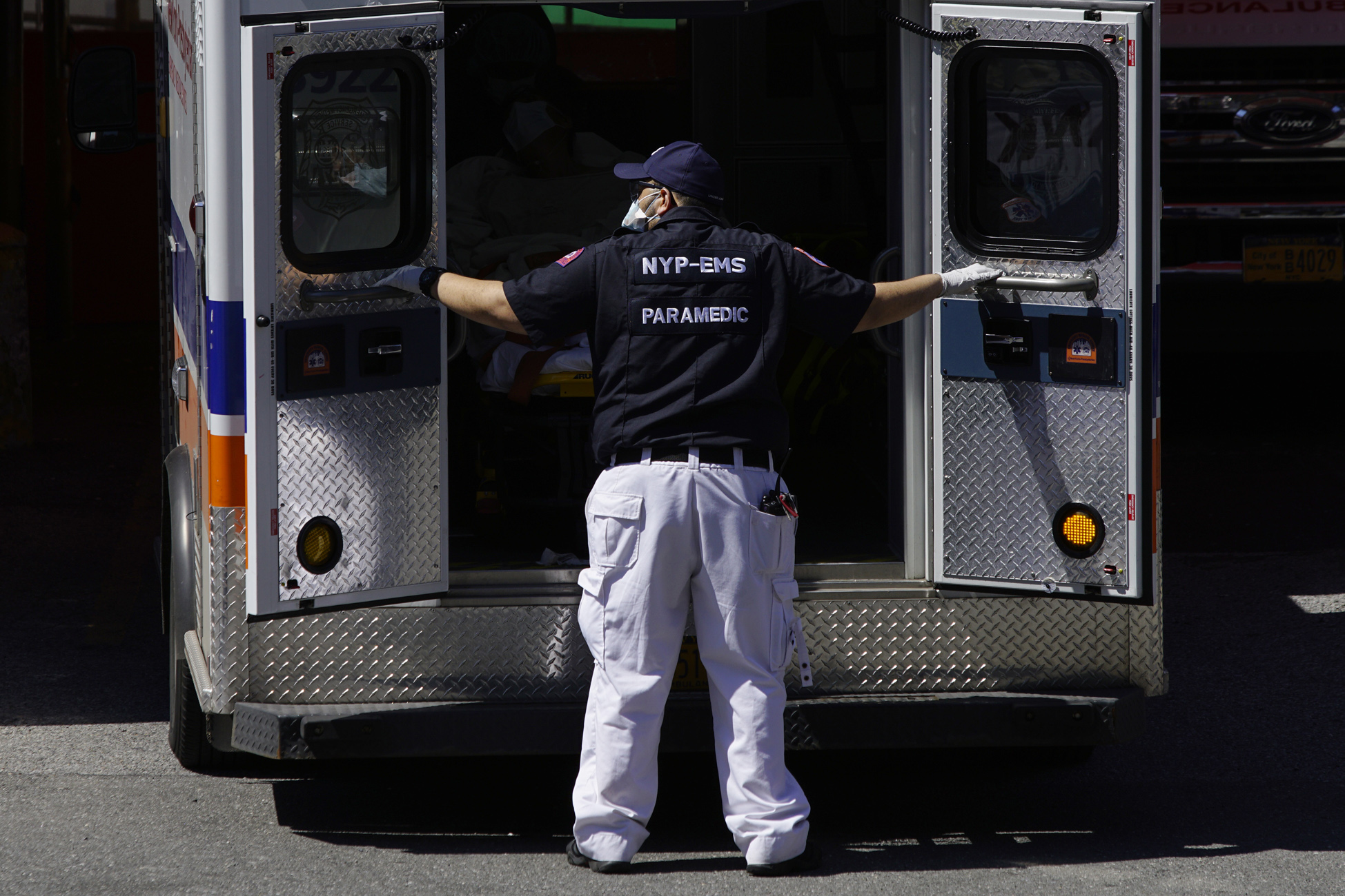 A paramedic closes the doors to an ambulance outside Elmhurst Hospital during the outbreak of the coronavirus disease (COVID-19) in the Queens borough of New York City, New York, U.S., April 6, 2020. REUTERS