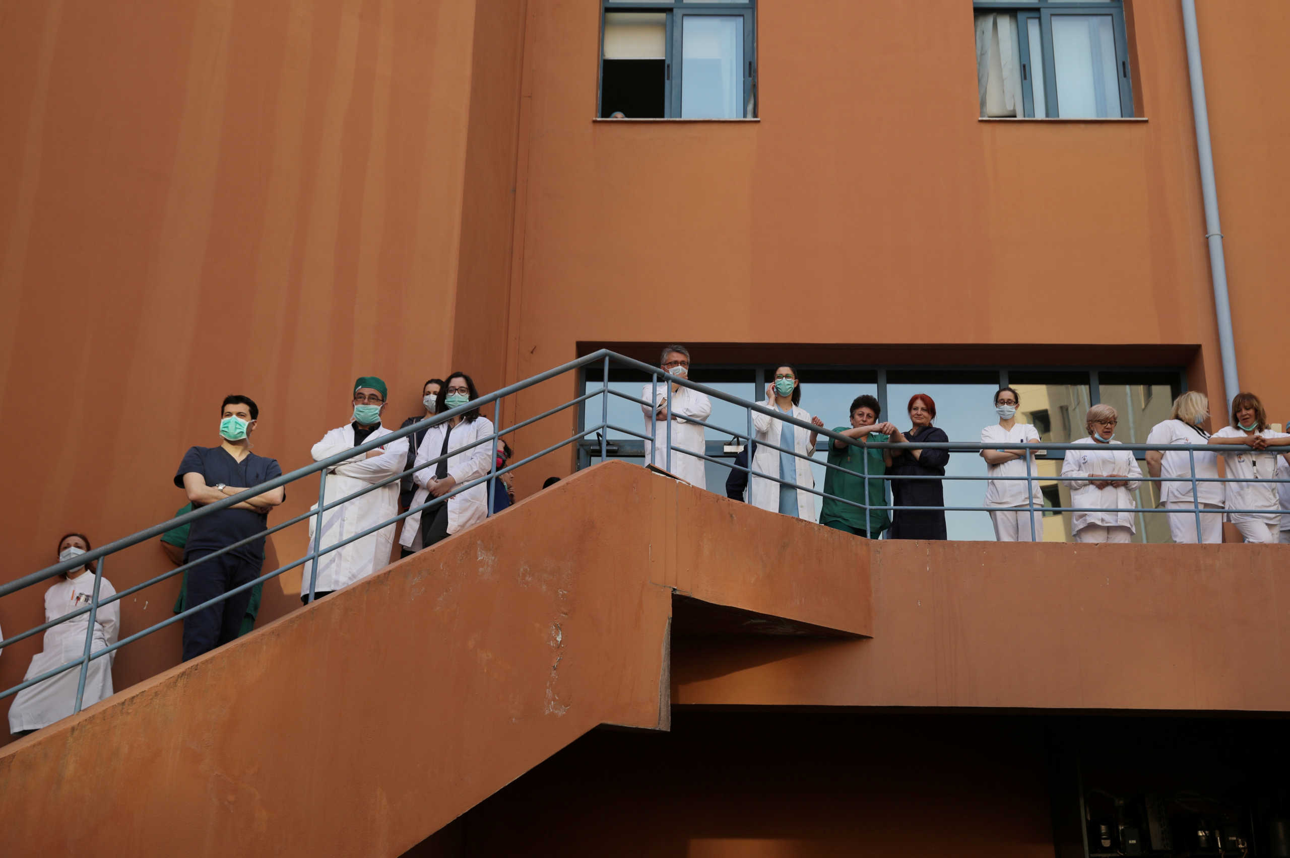 Medical workers watch a concert by the Hellenic Broadcasting Corporation (ERT) orchestra at the Attikon hospital, during the outbreak of coronavirus disease (COVID-19) in Athens, Greece, on April 23, 2020. REUTERS