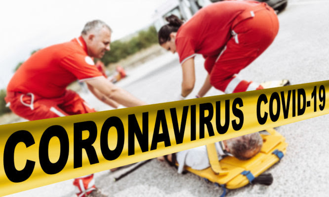 man on the ground after a car crash