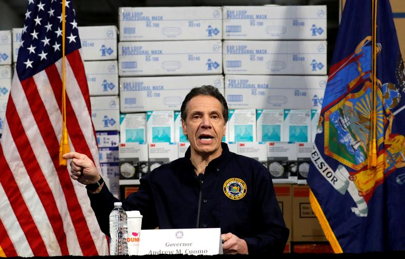FILE PHOTO: New York Governor Andrew Cuomo speaks in front of stacks of medical protective supplies during a news conference at the Jacob K. Javits Convention Center which will be partially converted into a temporary hospital during the outbreak of the coronavirus disease (COVID-19) in New York City, New York, U.S., March 24, 2020. REUTERS