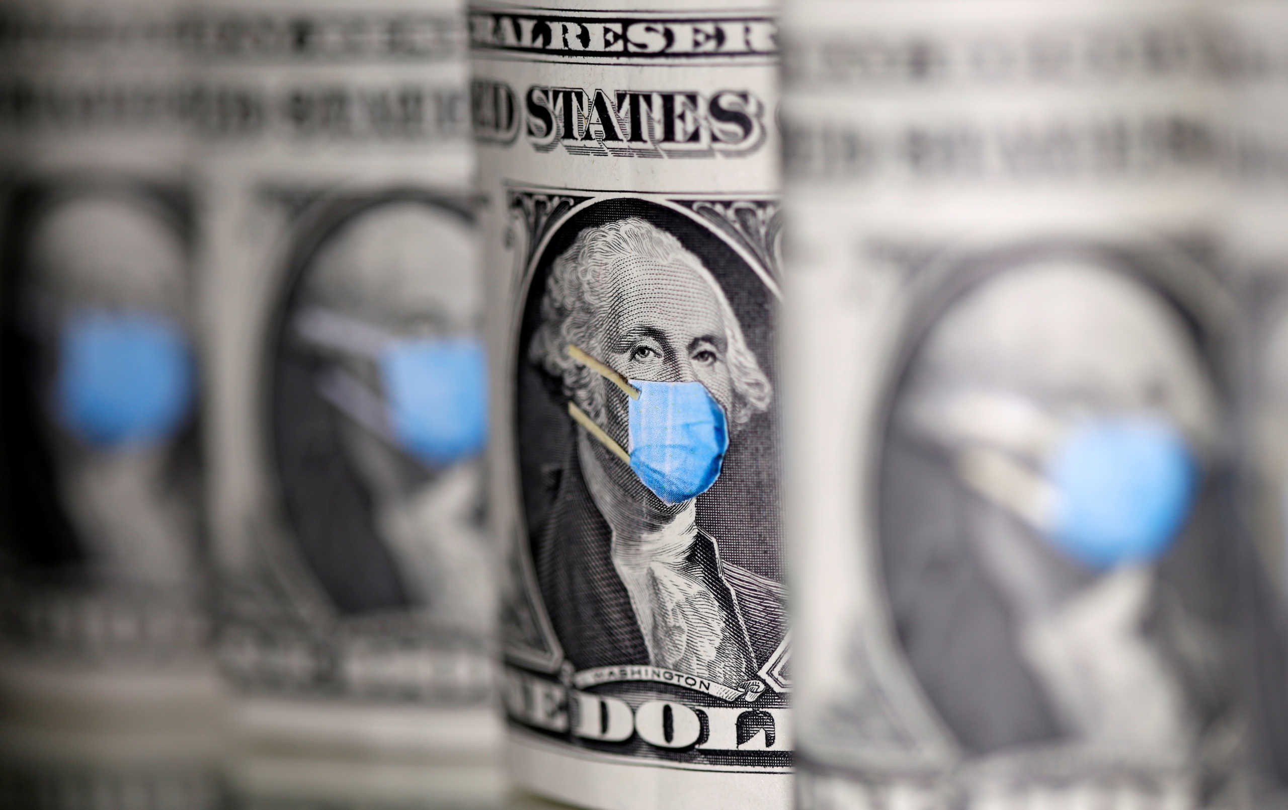 FILE PHOTO: George Washington is seen with printed medical mask on the one Dollar banknotes in this illustration taken, March 31, 2020. REUTERS