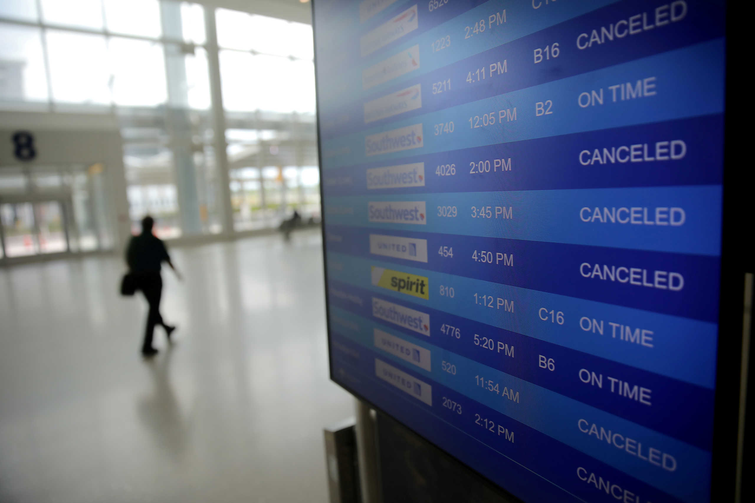 FILE PHOTO: Canceled flights are seen on an airport screen in New Orleans, Louisiana U.S., April 4, 2020. REUTERS