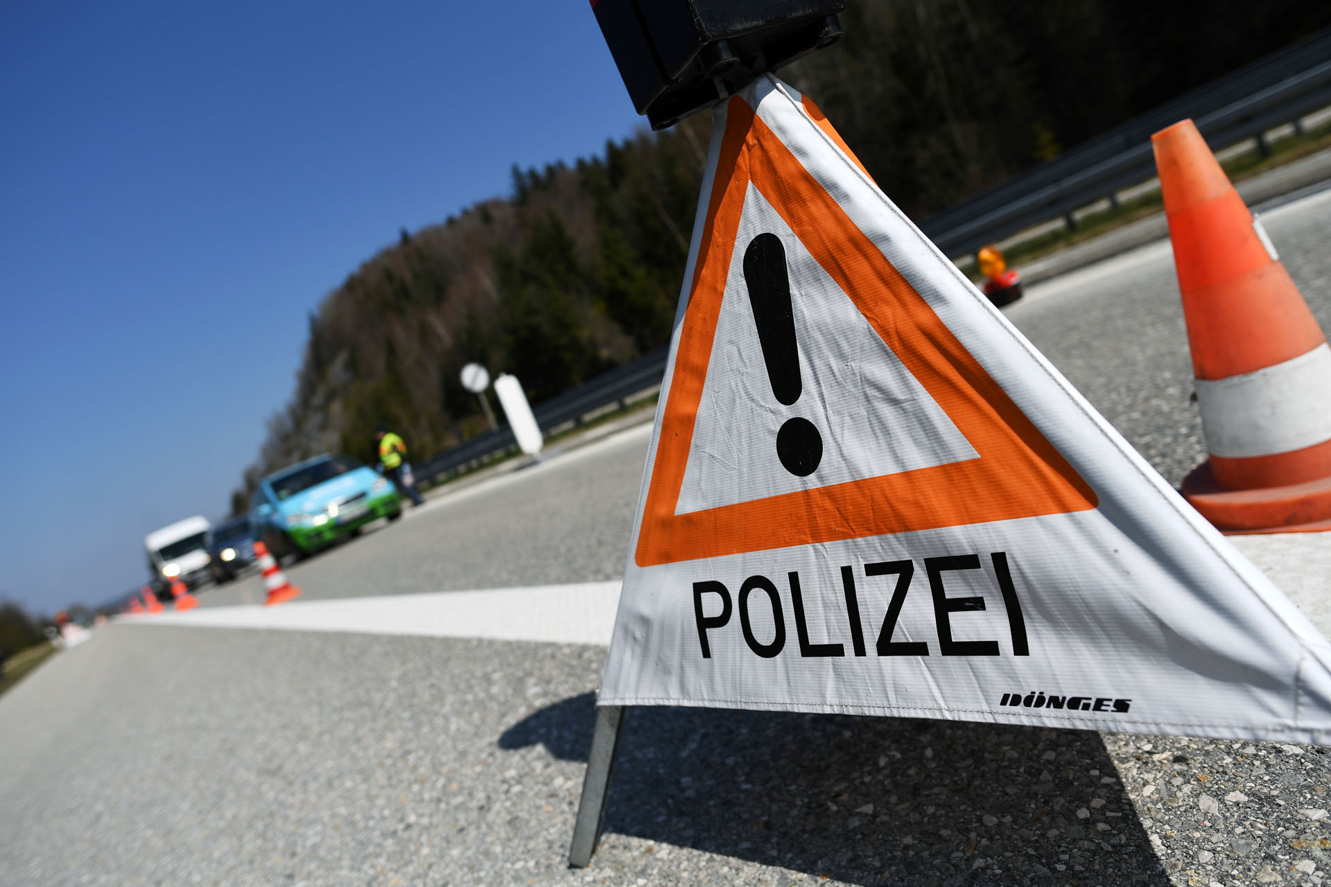Cars wait at a police checkpoint at the end of A95 motorway from Munich as the spread of the coronavirus disease (COVID-19) continues near Garmisch-Partenkirchen, Germany, April 4, 2020. REUTERS
