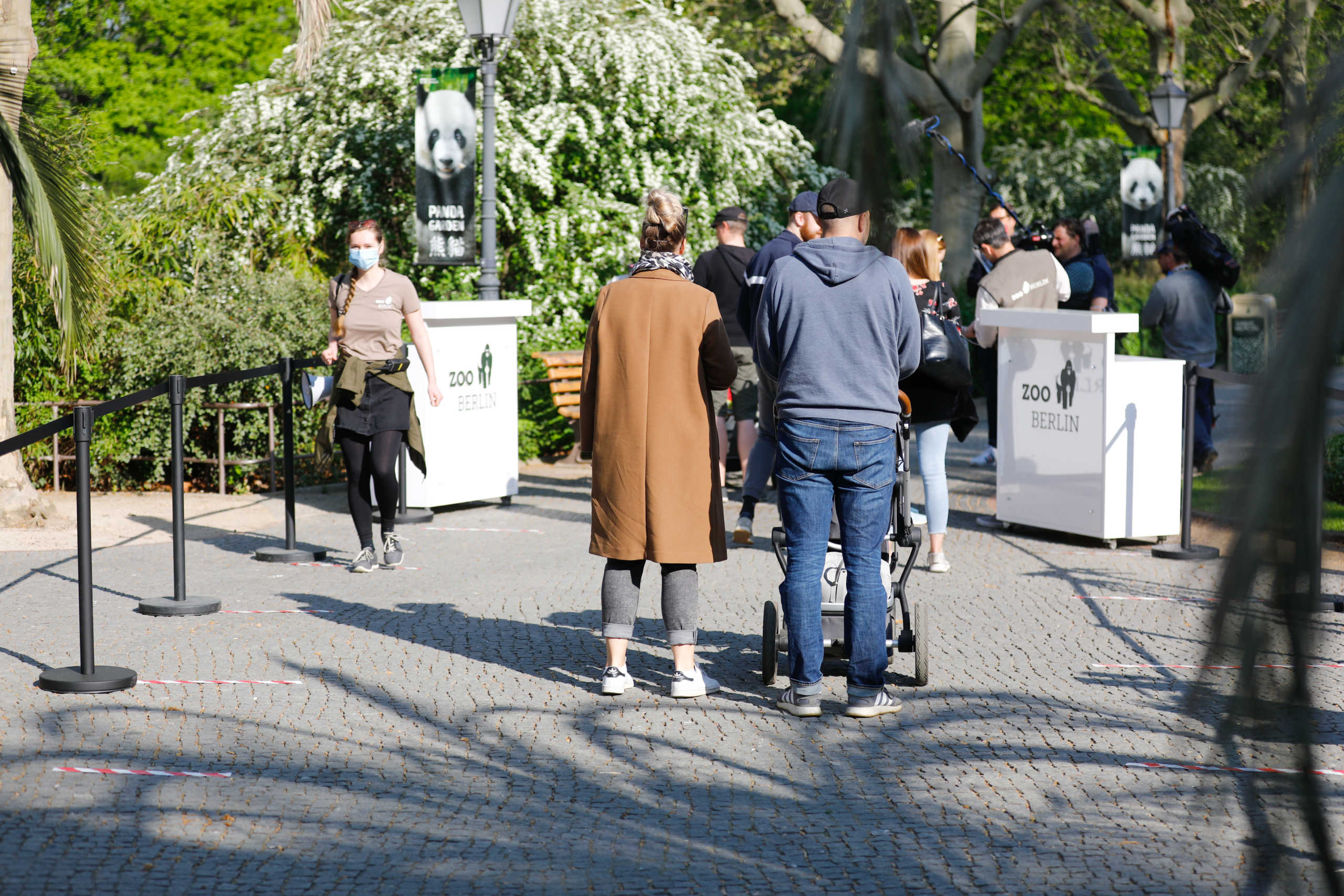 Visitors walk through the reopened zoo, in compliance with the current distance regulations, as the spread of the coronavirus disease (COVID-19) continues in Berlin, Germany, April 28, 2020. REUTERS