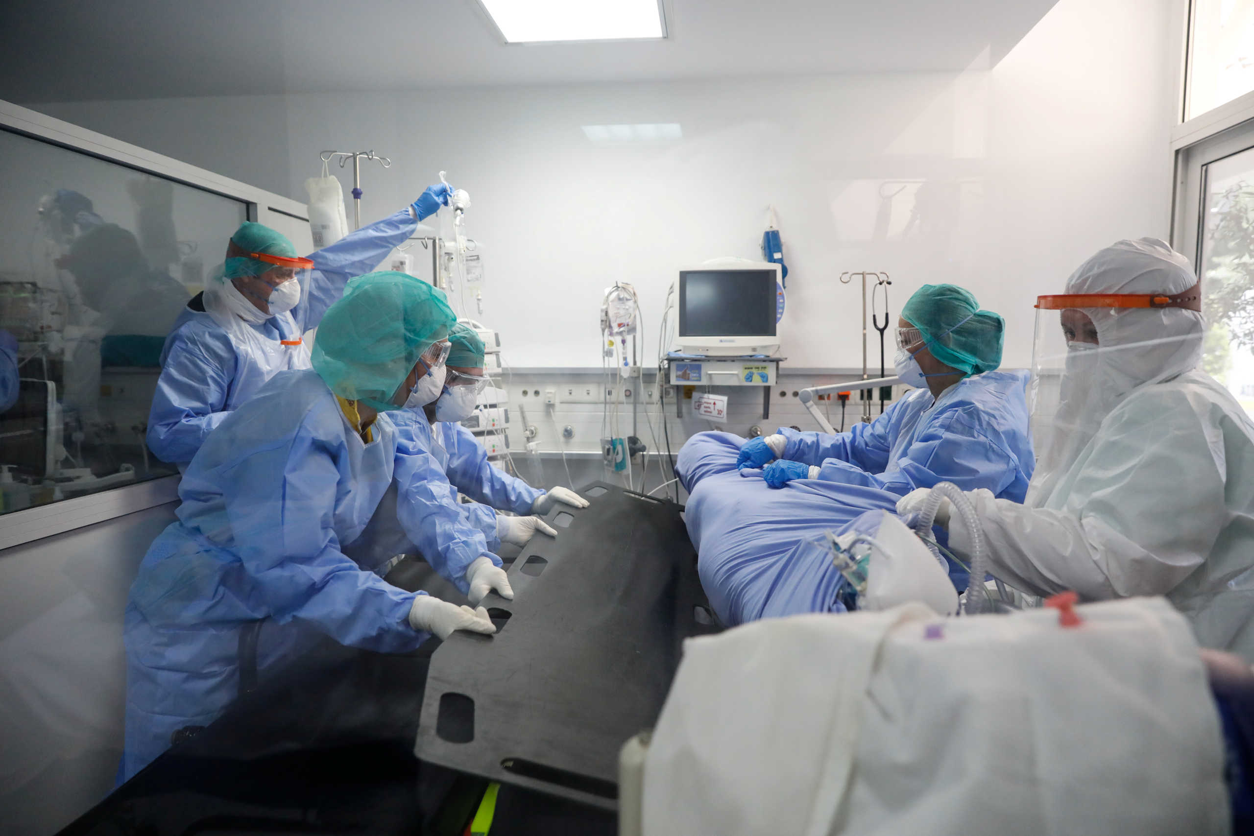 Medical workers prepare to transfer a patient for a CT scan at the intensive care unit (ICU) of the Sotiria hospital, following the coronavirus disease (COVID-19) outbreak, in Athens, Greece, April 22, 2020. REUTERS