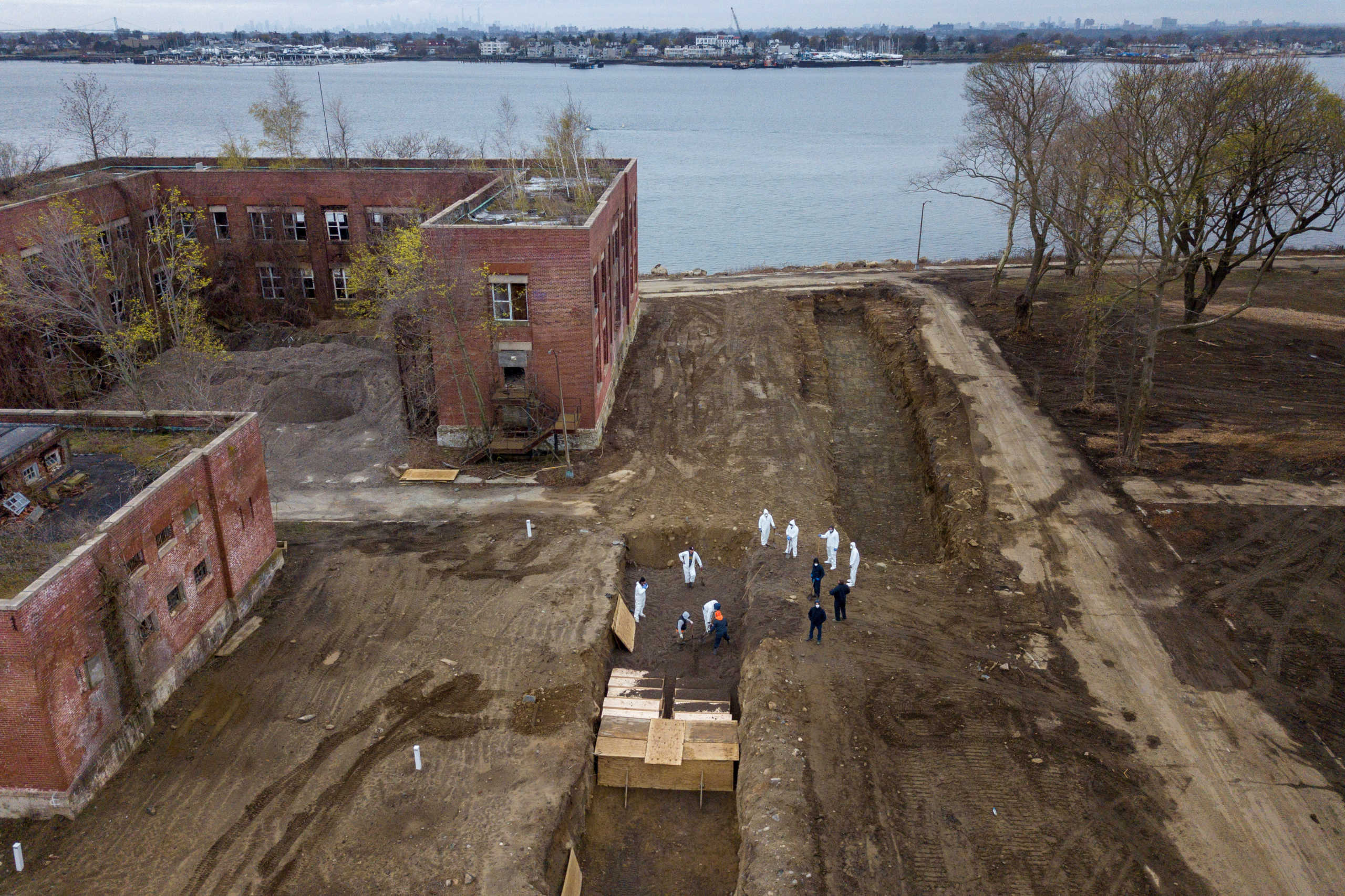 Drone pictures show bodies being buried on New York's Hart Island where the department of corrections is dealing with more burials overall, amid the coronavirus disease (COVID-19) outbreak in New York City, U.S., April 9, 2020. REUTERS