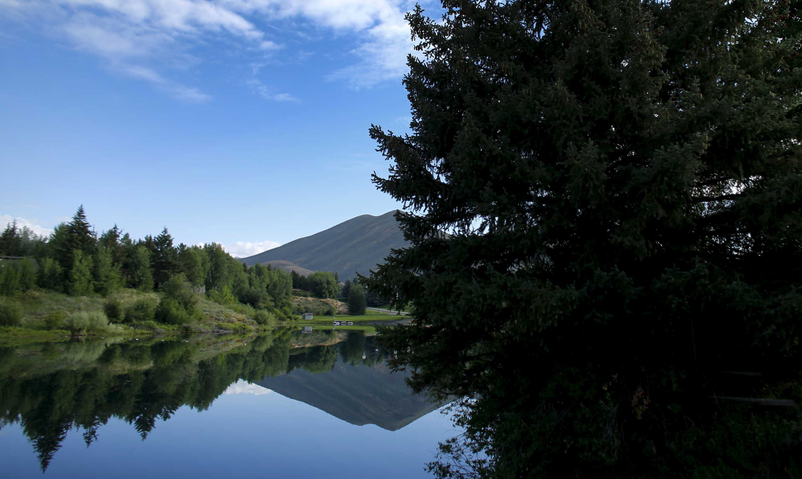 Sun Valley Lake reflects local scenery during summer time in Sun Valley, Idaho, July 6, 2015. REUTERS