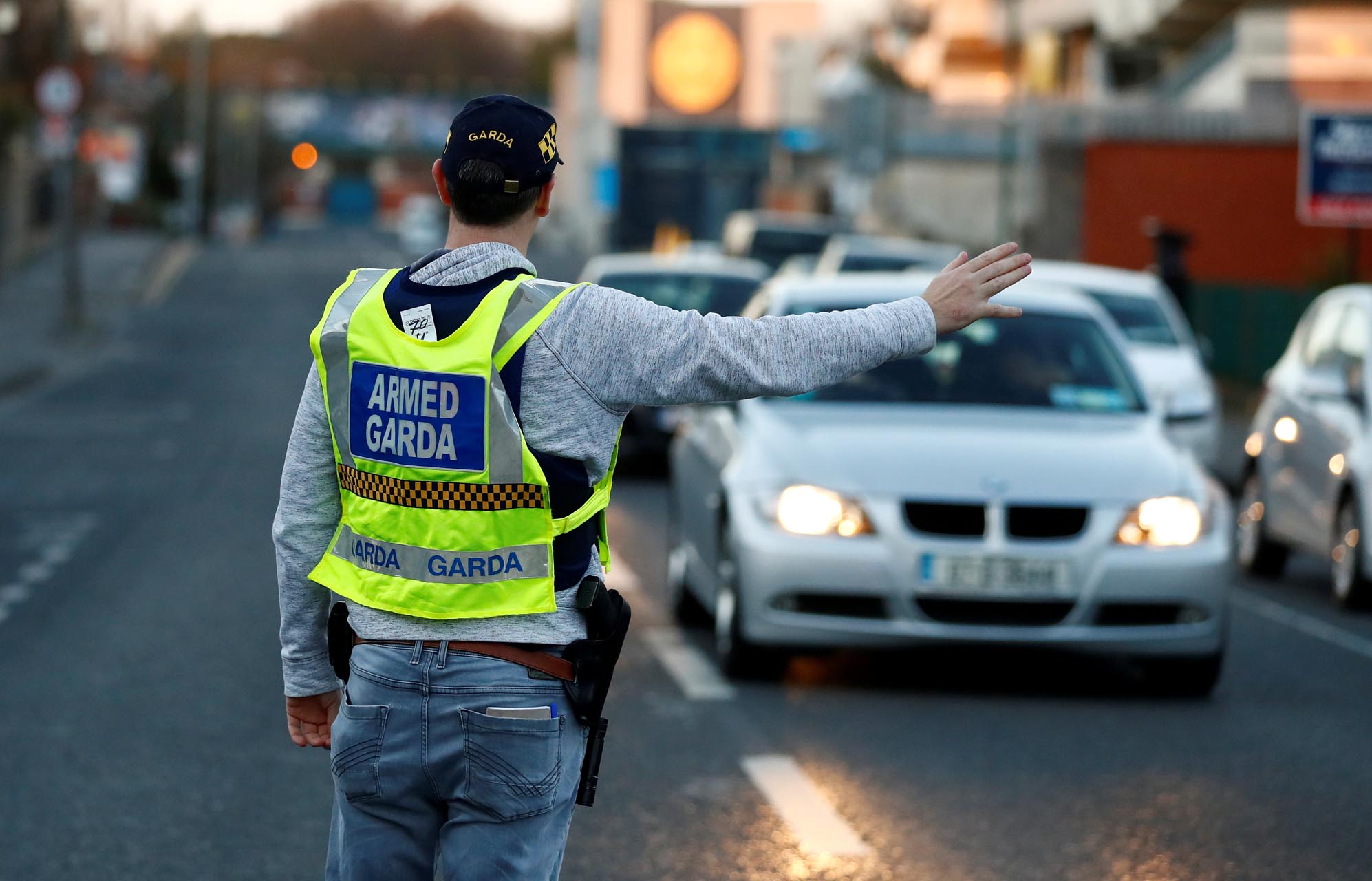 FILE PHOTO: A police officer is seen on the streets of Dublin as the spread of the coronavirus disease (COVID-19) continues, Dublin, Ireland, March 29, 2020. REUTERS