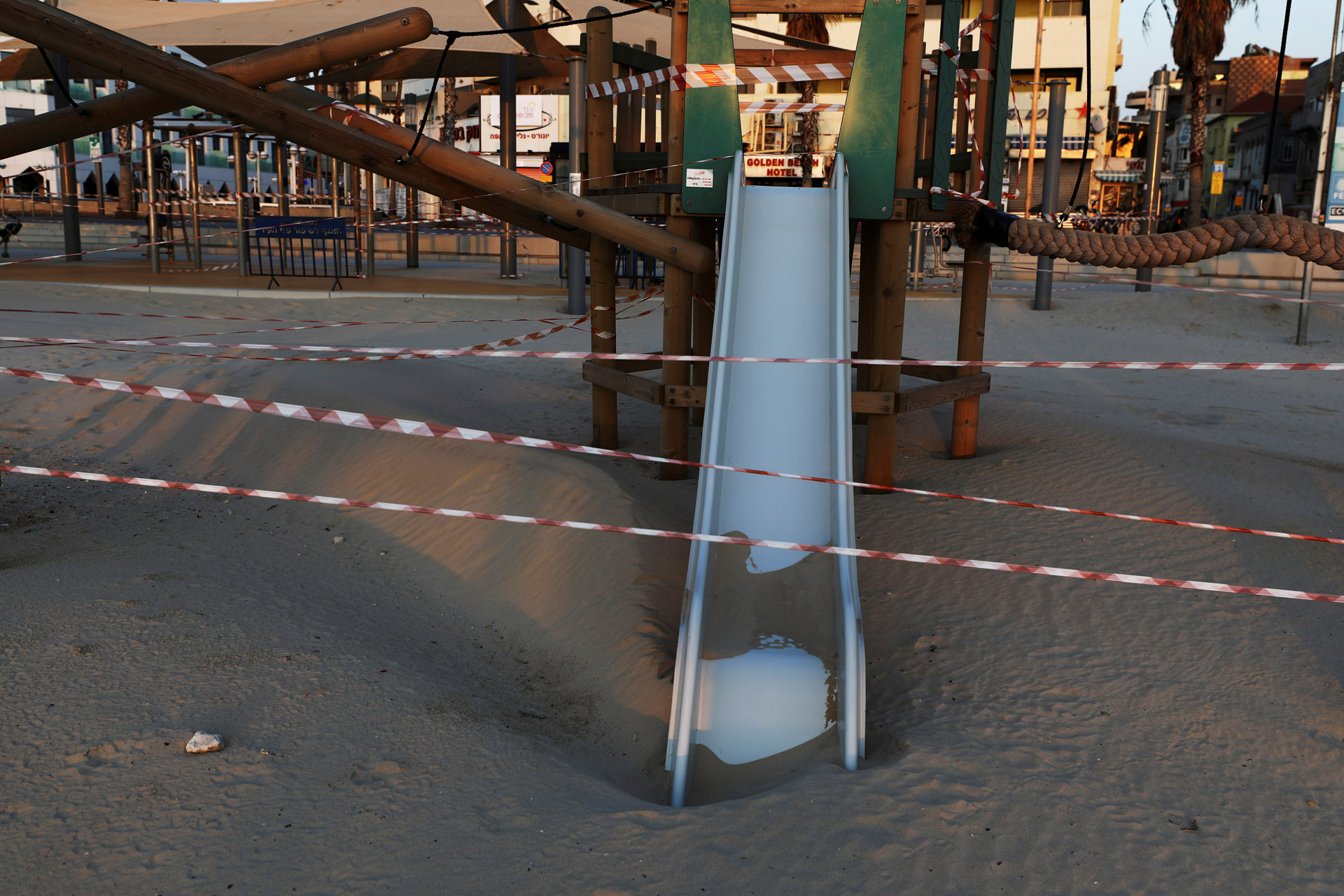 An outdoor playground is limited with plastic strips to prevent people from using it amid the coronavirus disease (COVID-19) restrictions by the Mediterranean shore in Tel Aviv, Israel  April 14, 2020 REUTERS