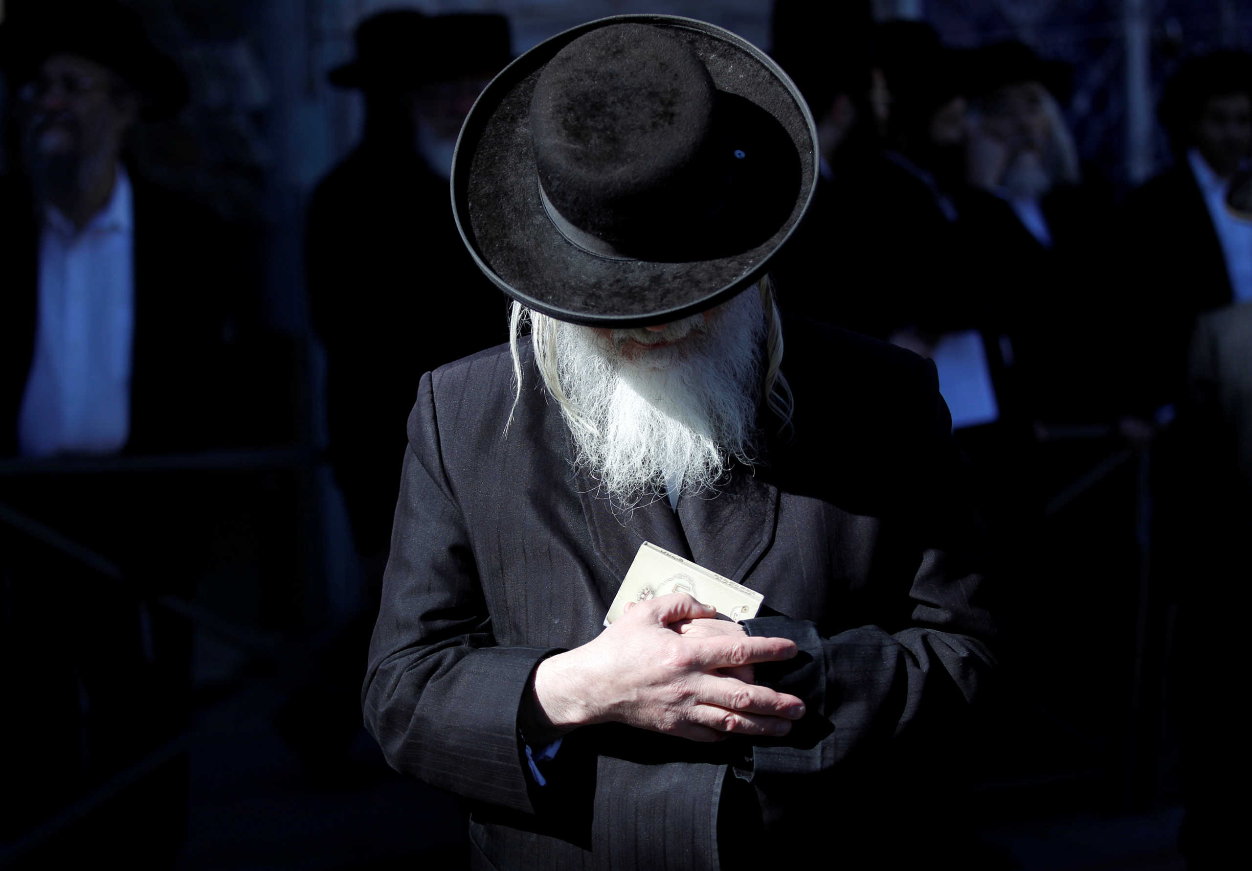 FILE PHOTO: An Ultra-Orthodox Jewish man prays during a protest in Jerusalem February 12, 2014. Hundreds of men protested against construction at a site in the nearby town of Beit Shemesh where they believe ancient Jewish graves are located. REUTERS