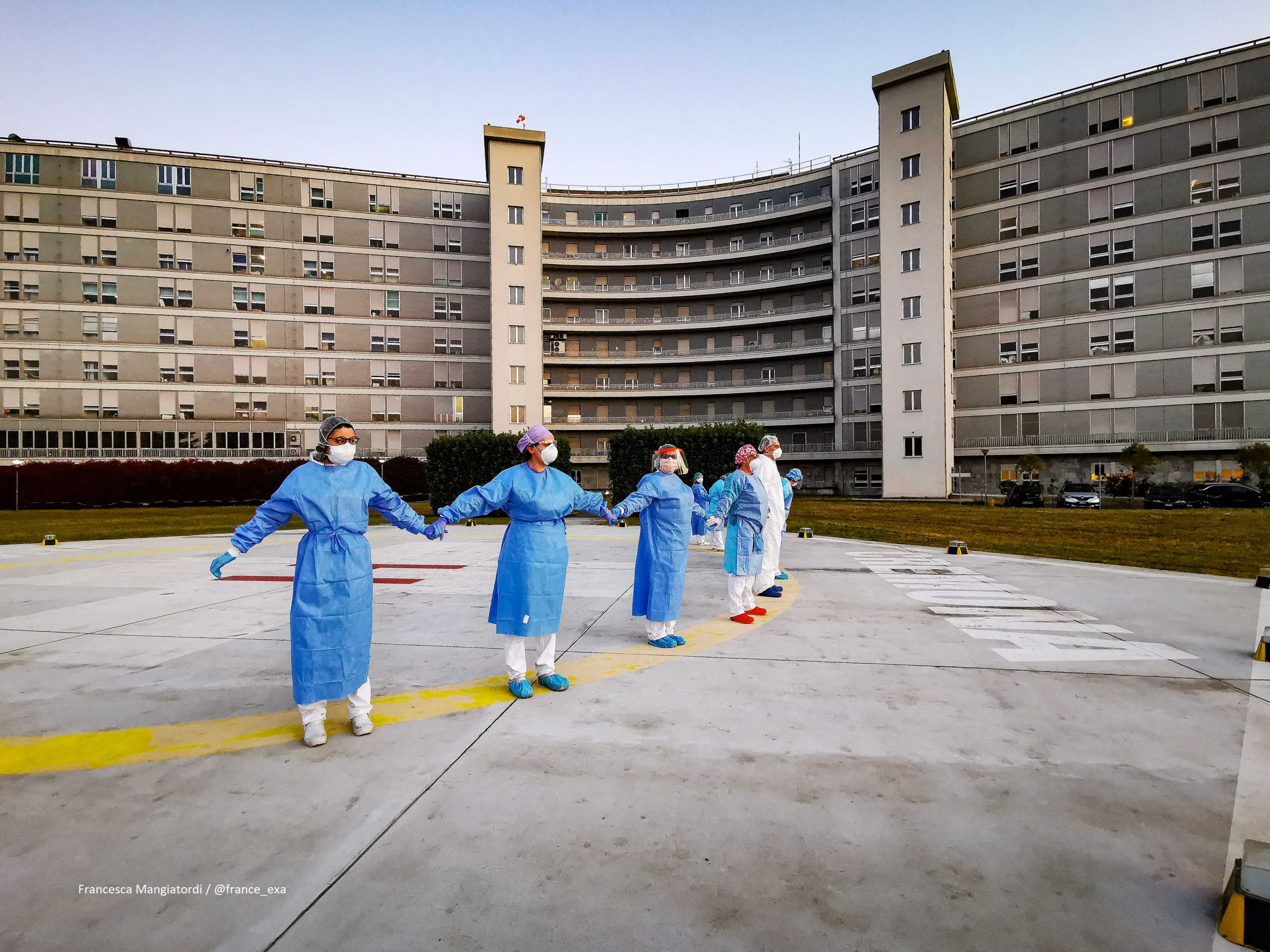 Medical staff from a hospital in Cremona hold hands as they show support for people affected with the coronavirus disease (COVID-19): victims, their families and those in recovery, in Cremona, Italy April 6, 2020 in this picture obtained from social media. Francesca Mangiatordi